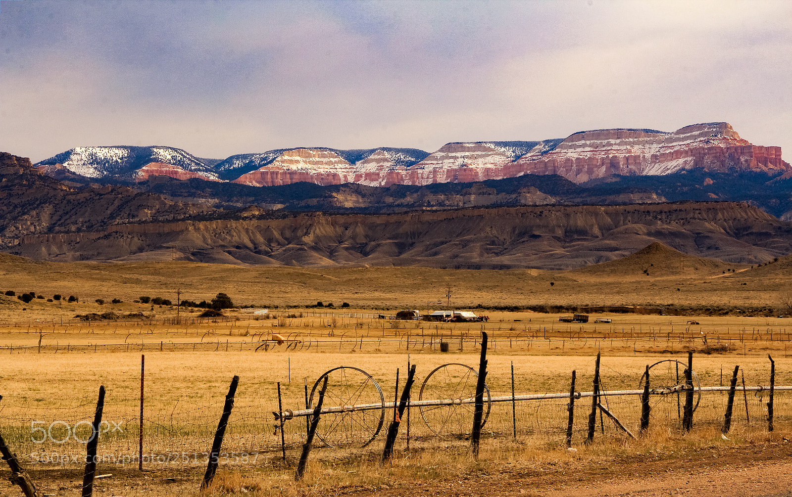 Canon EOS 60D sample photo. Mountains behind fields photography