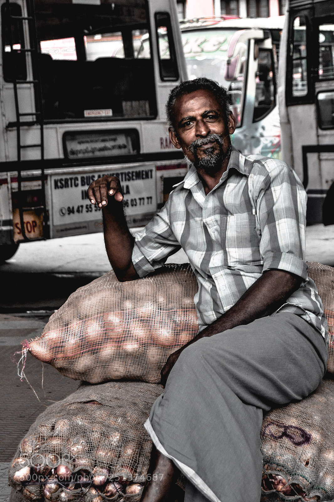 Nikon D3100 sample photo. Street portrait of vendor photography