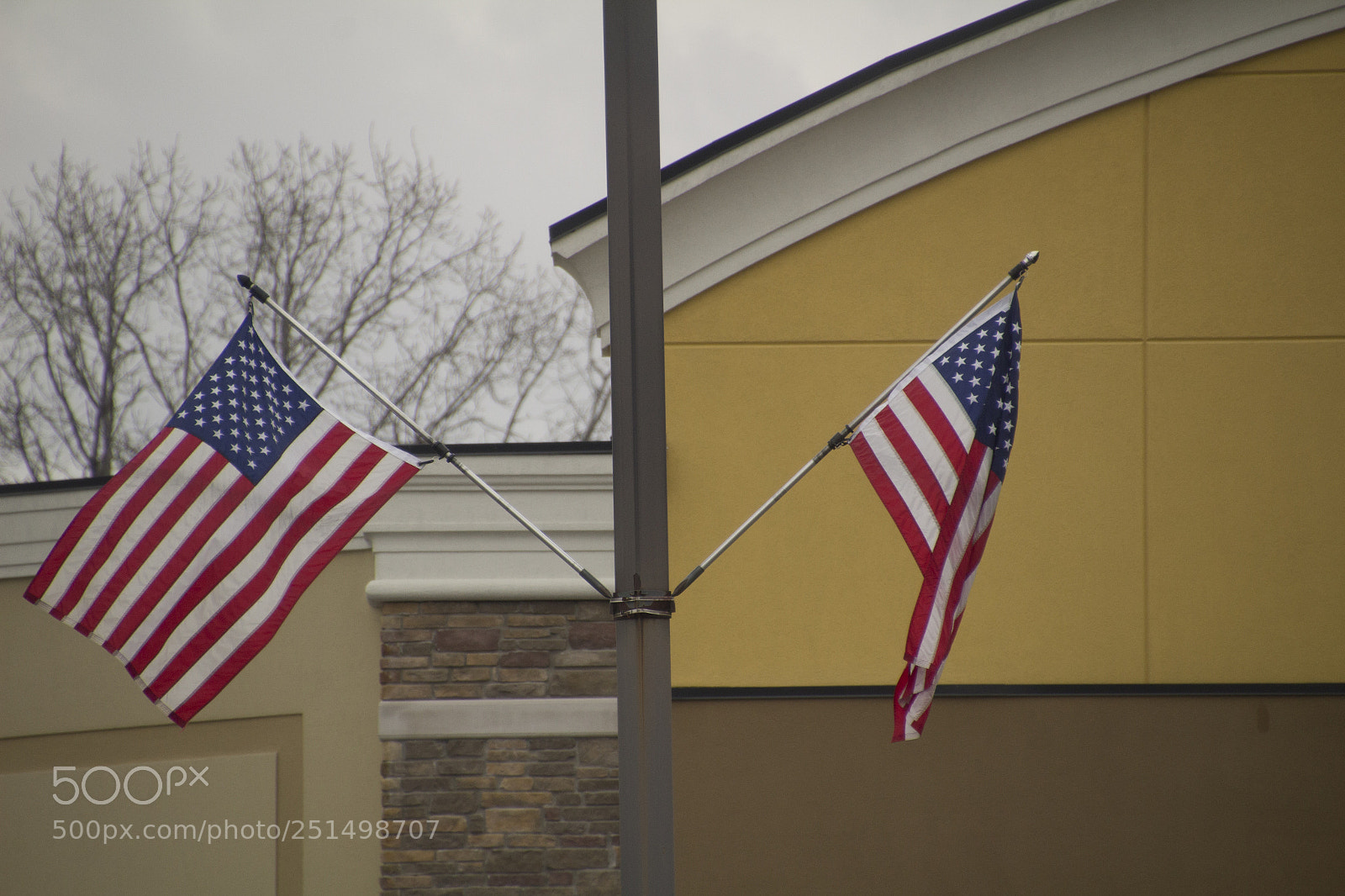 Canon EOS 1200D (EOS Rebel T5 / EOS Kiss X70 / EOS Hi) sample photo. American flags and architecture photography