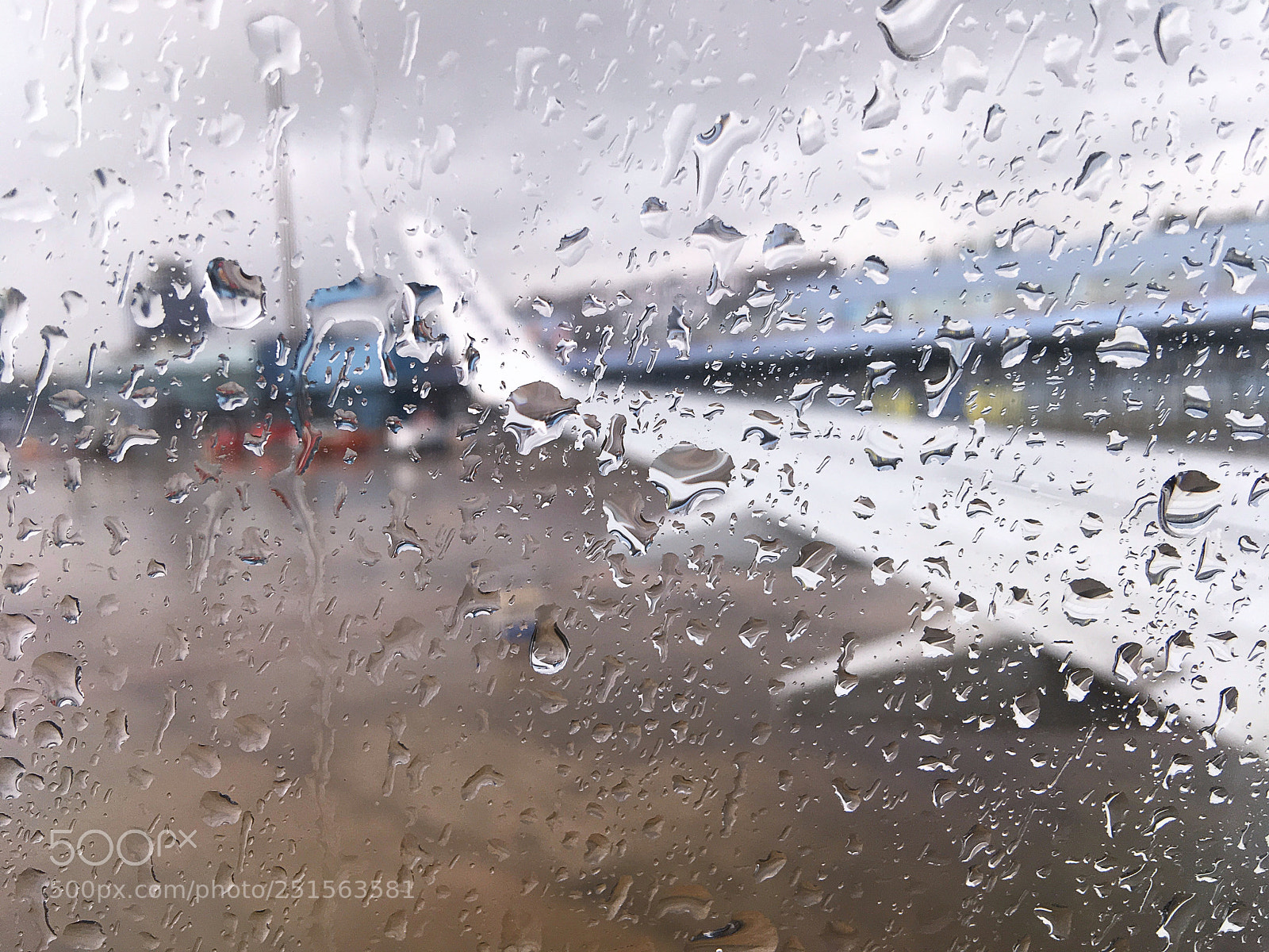 Apple iPhone SE sample photo. Airplane window with drops photography
