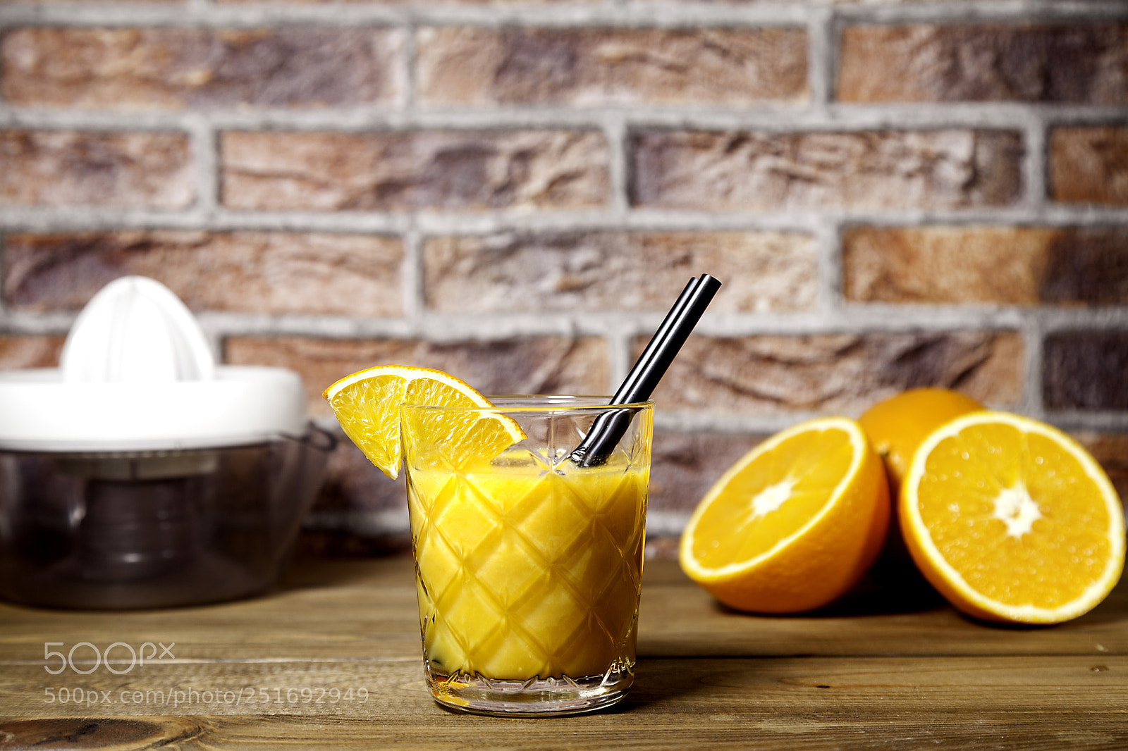 Canon EOS 5D Mark II sample photo. Orange juice on brick photography