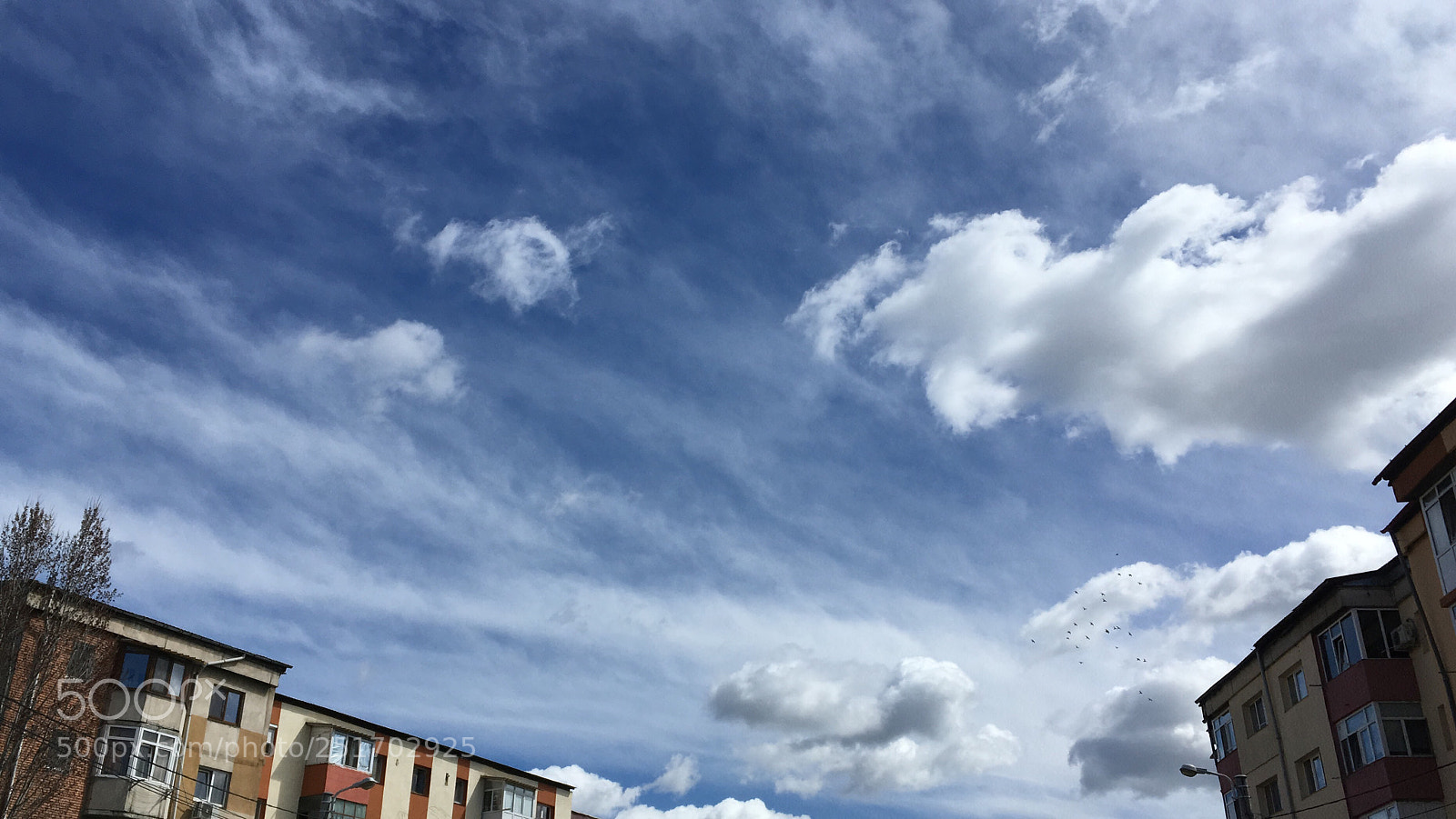 Apple iPhone SE sample photo. City clouds  photography