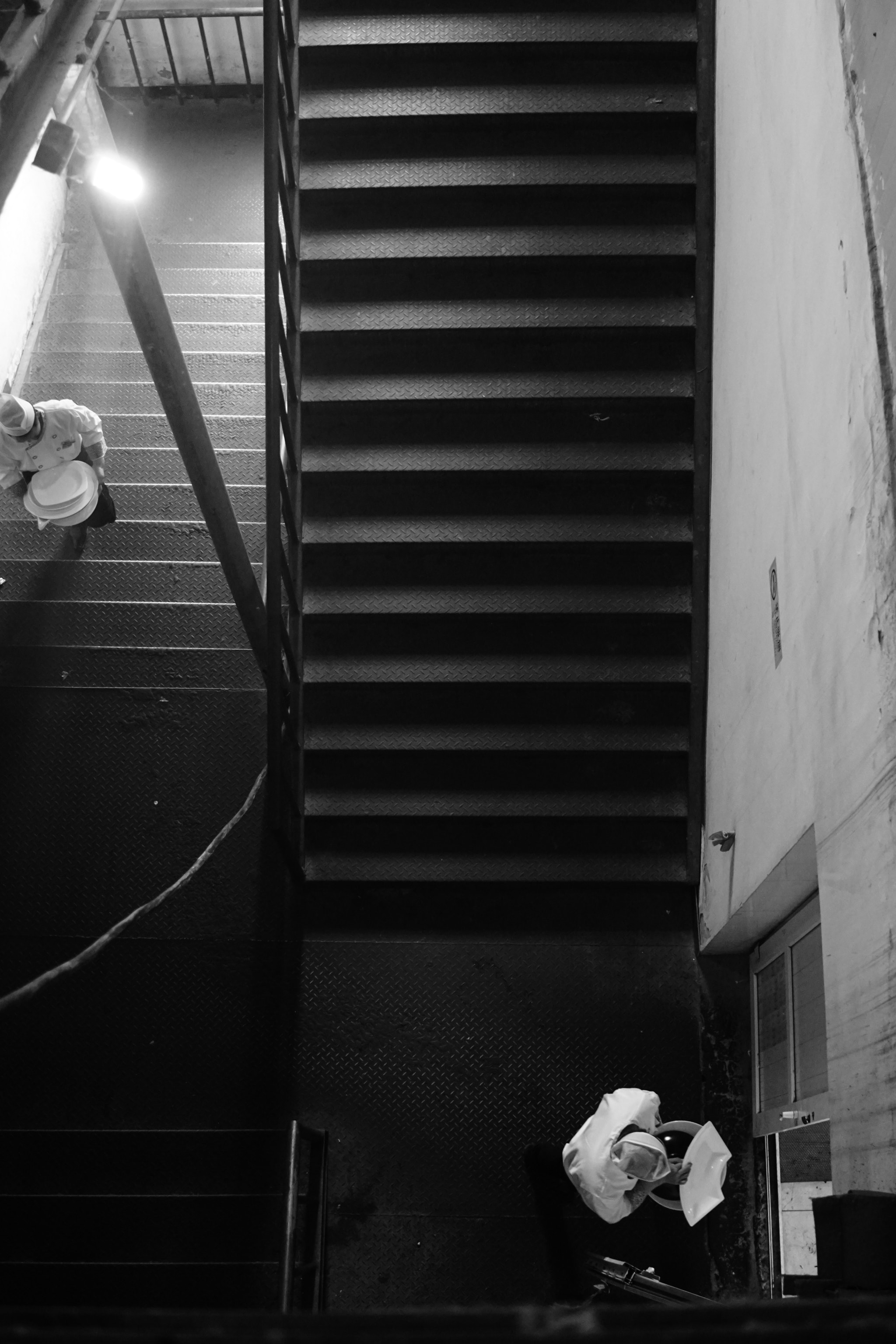 Sony FE 28mm F2 sample photo. Stairs and chefs photography