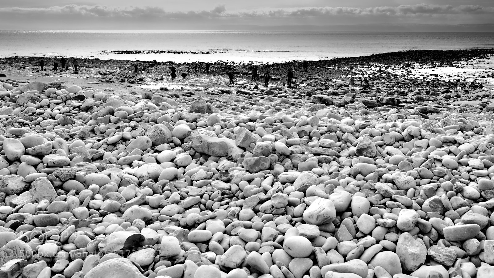 Nikon D3200 sample photo. Pebbles and beach commers photography