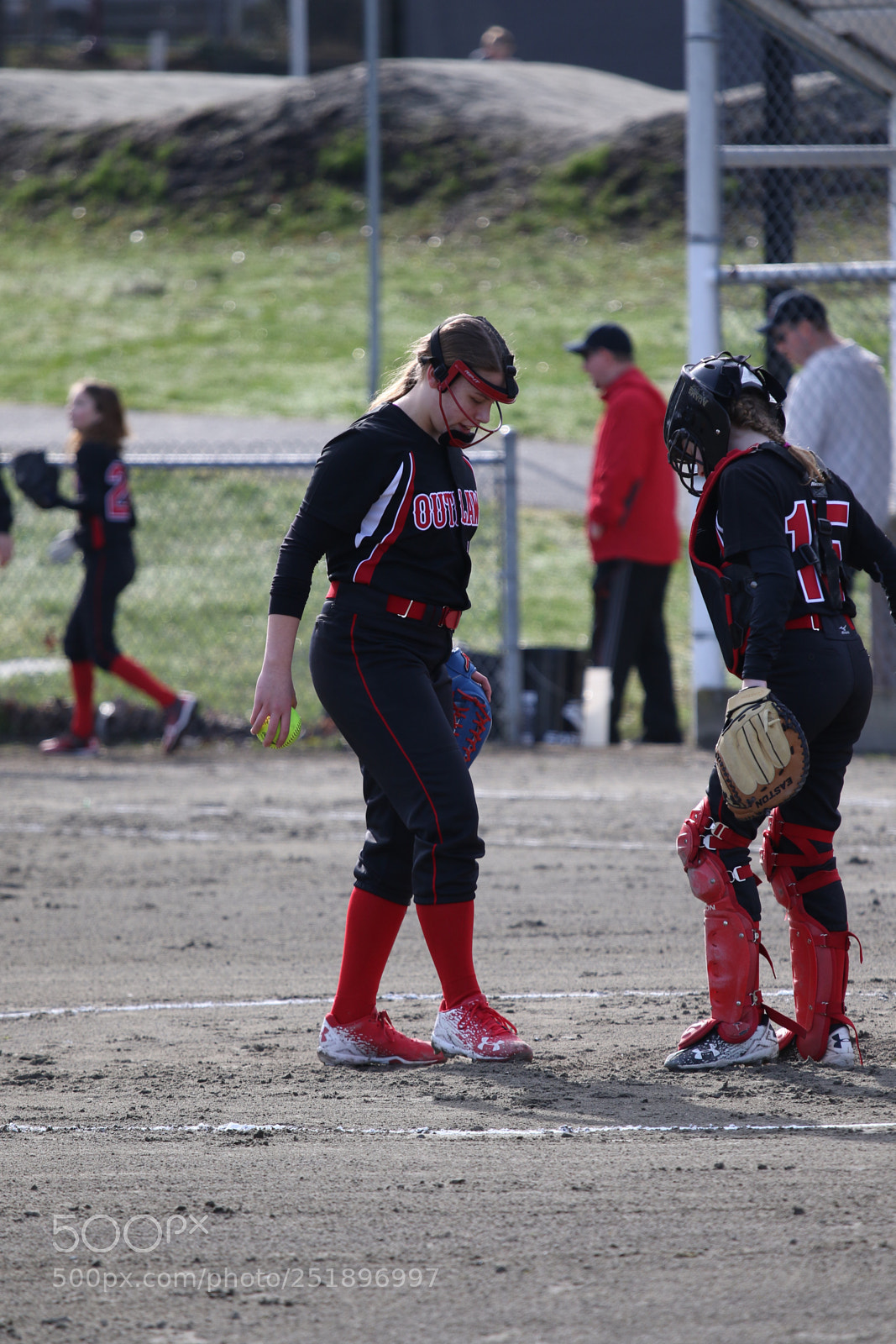 Canon EOS 7D Mark II sample photo. Pitcher & catcher, pre-game photography