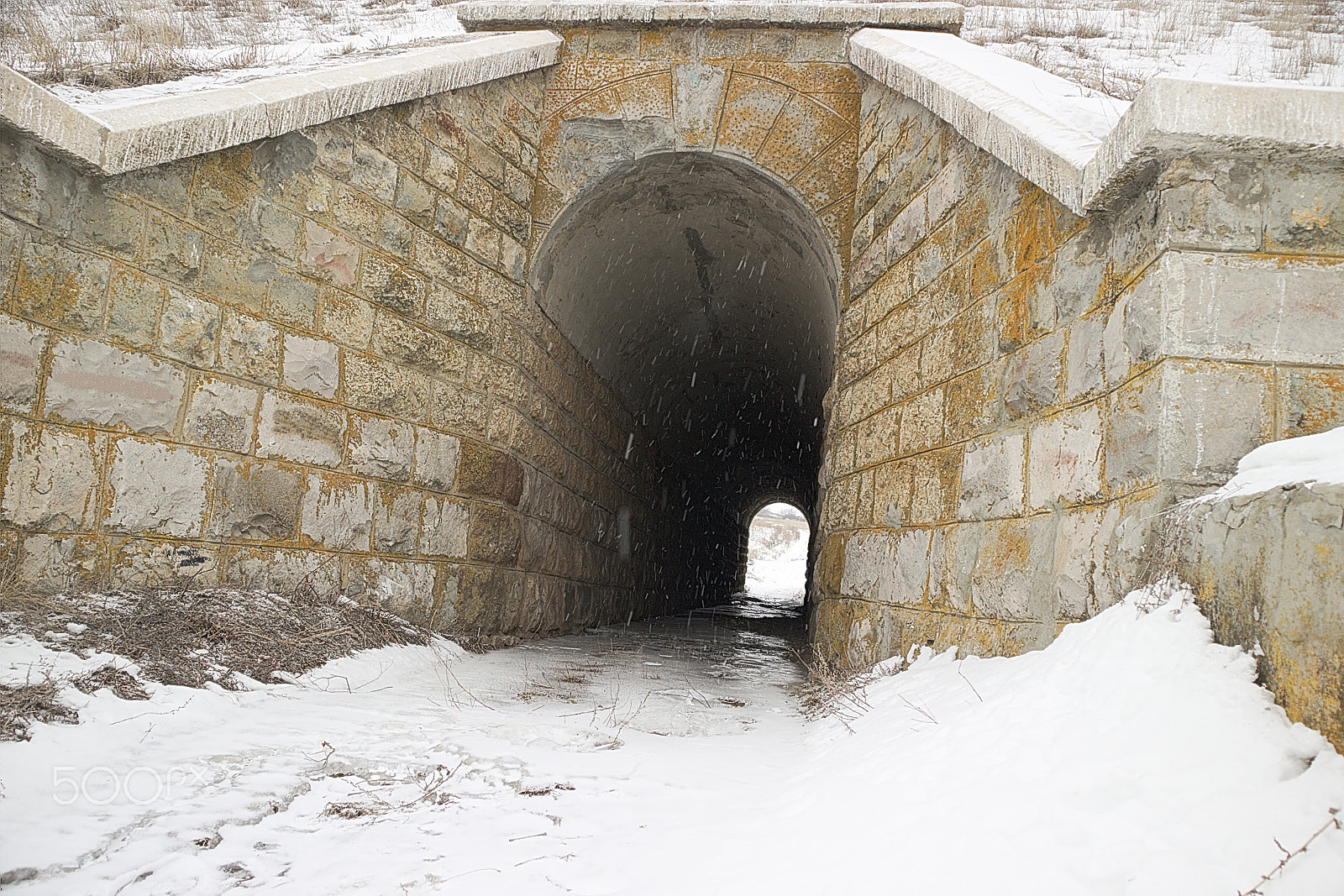 Canon EOS M10 sample photo. Tunnel under the railway on a winter day with long exposure photography