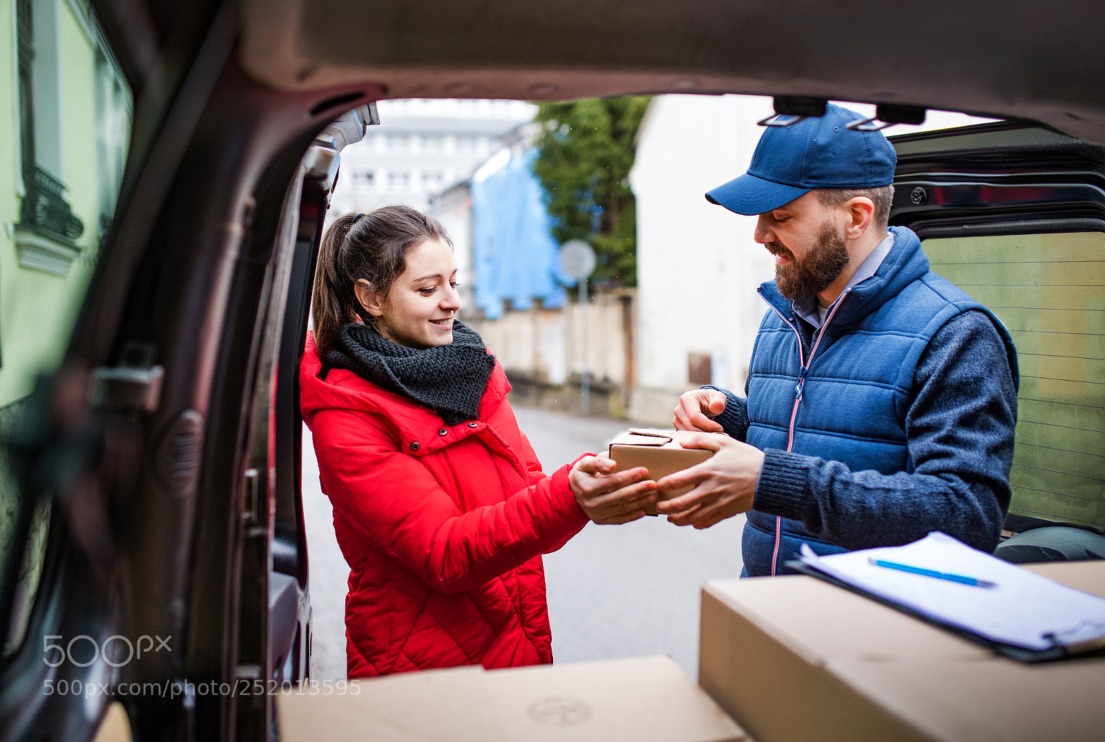 Nikon D5 sample photo. Woman receiving parcel from photography