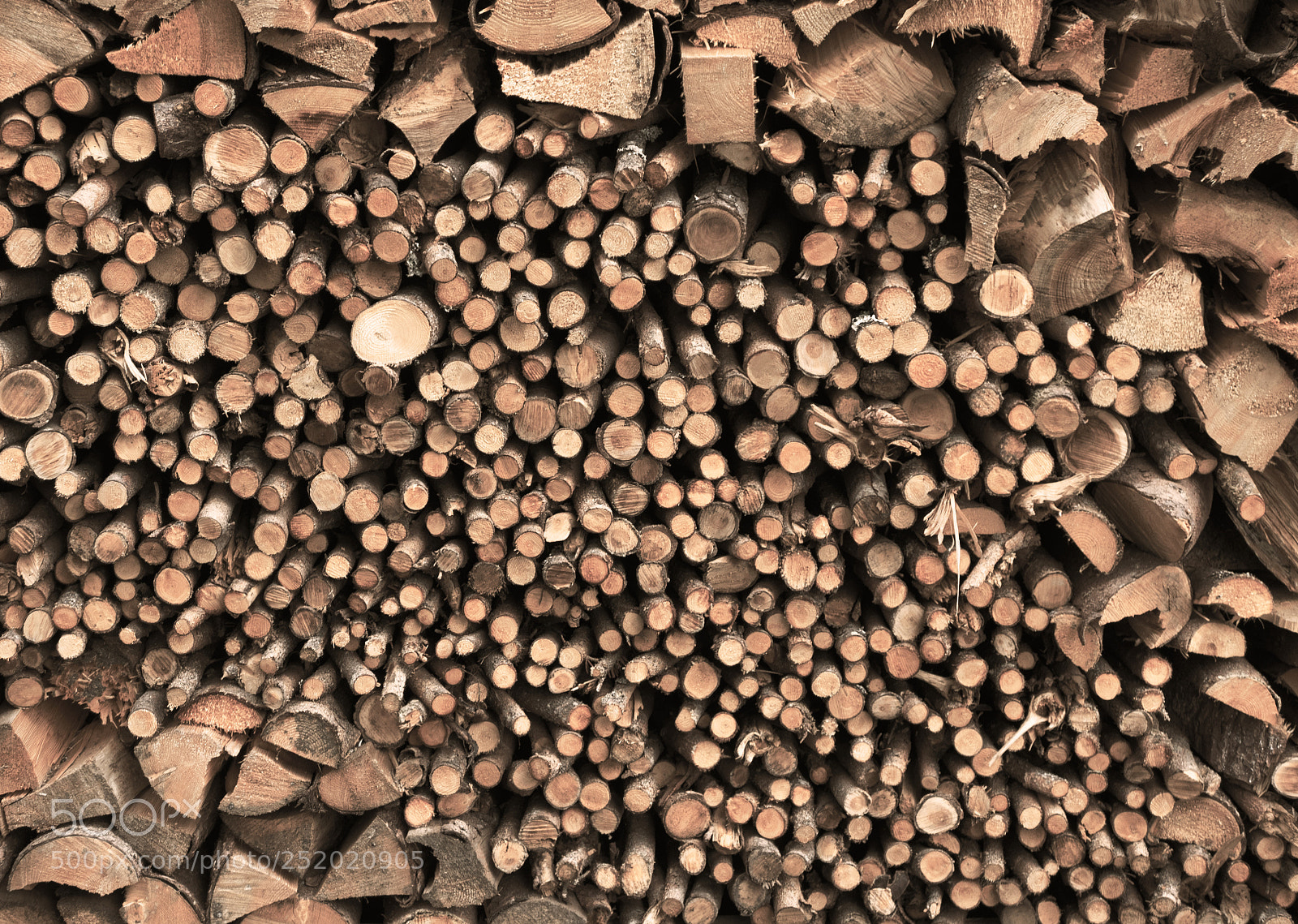 Panasonic Lumix DMC-LX100 sample photo. Stacked brown fire wood photography