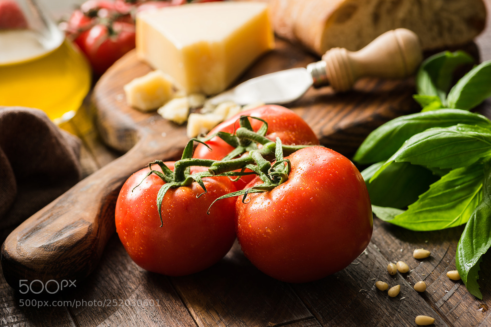 Nikon D810 sample photo. Tomatoes on vine, olive photography