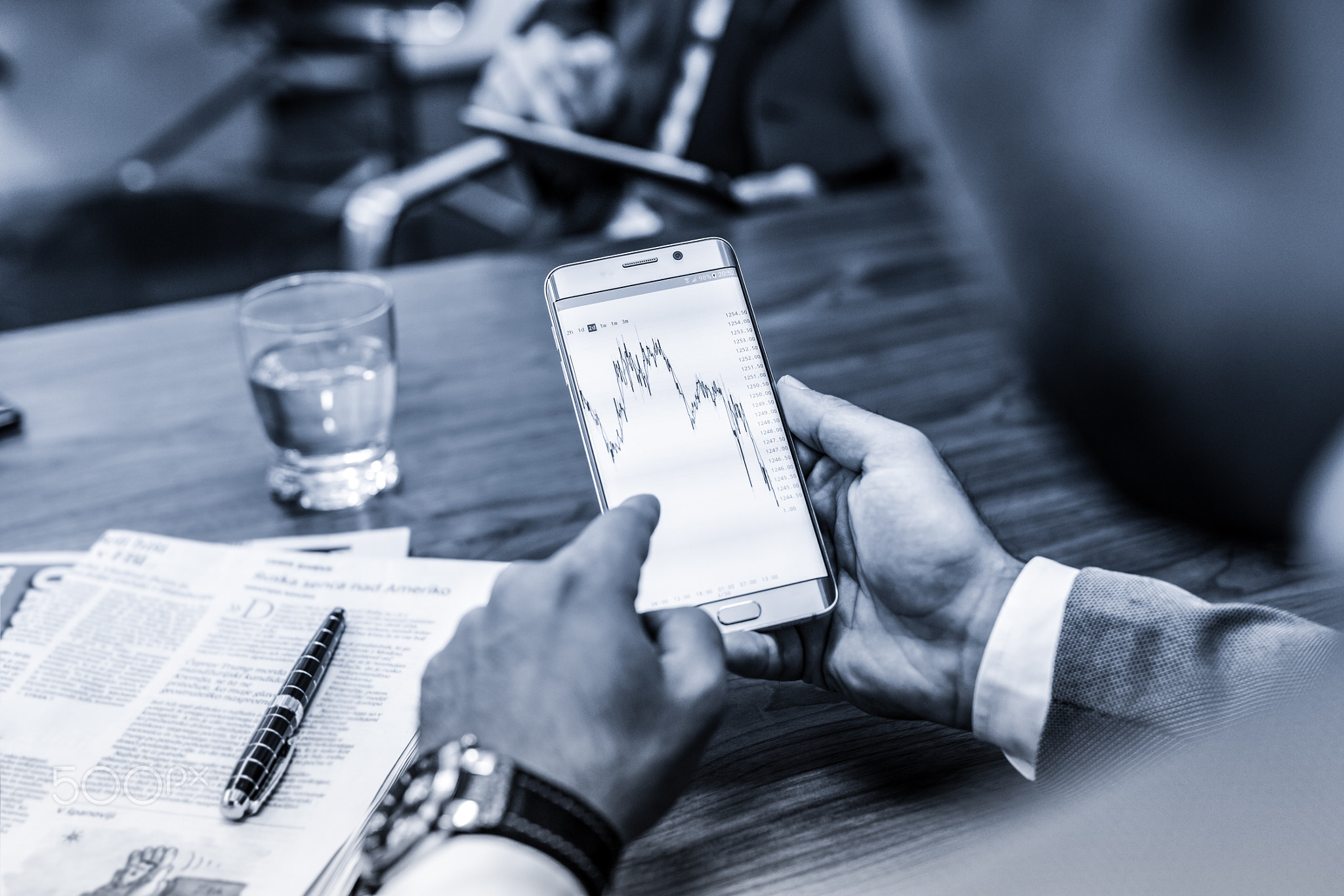 Close up of businessman using mobile smart phone.