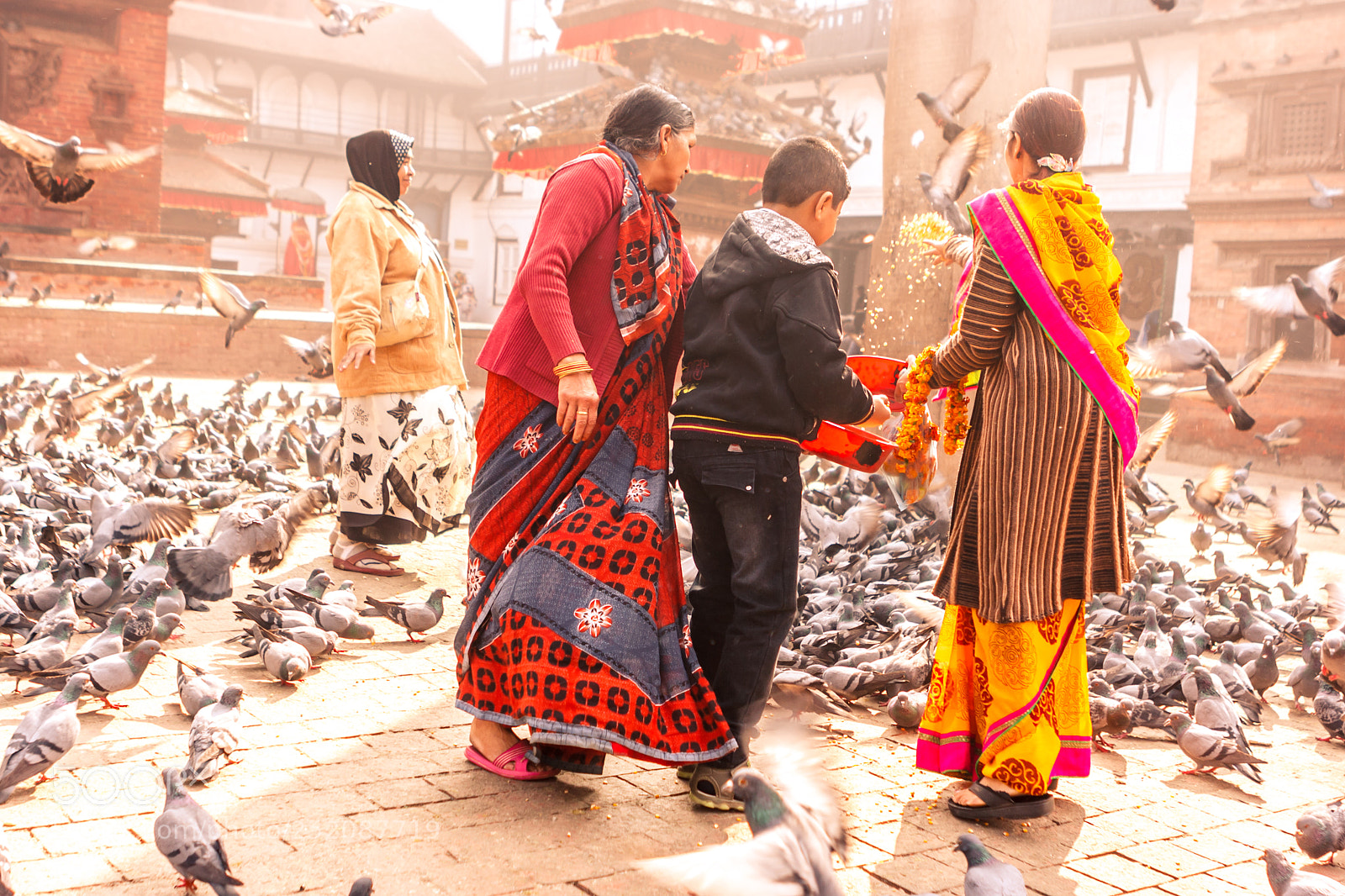 Canon EOS 400D (EOS Digital Rebel XTi / EOS Kiss Digital X) sample photo. Nepalese family feeding pigeons photography