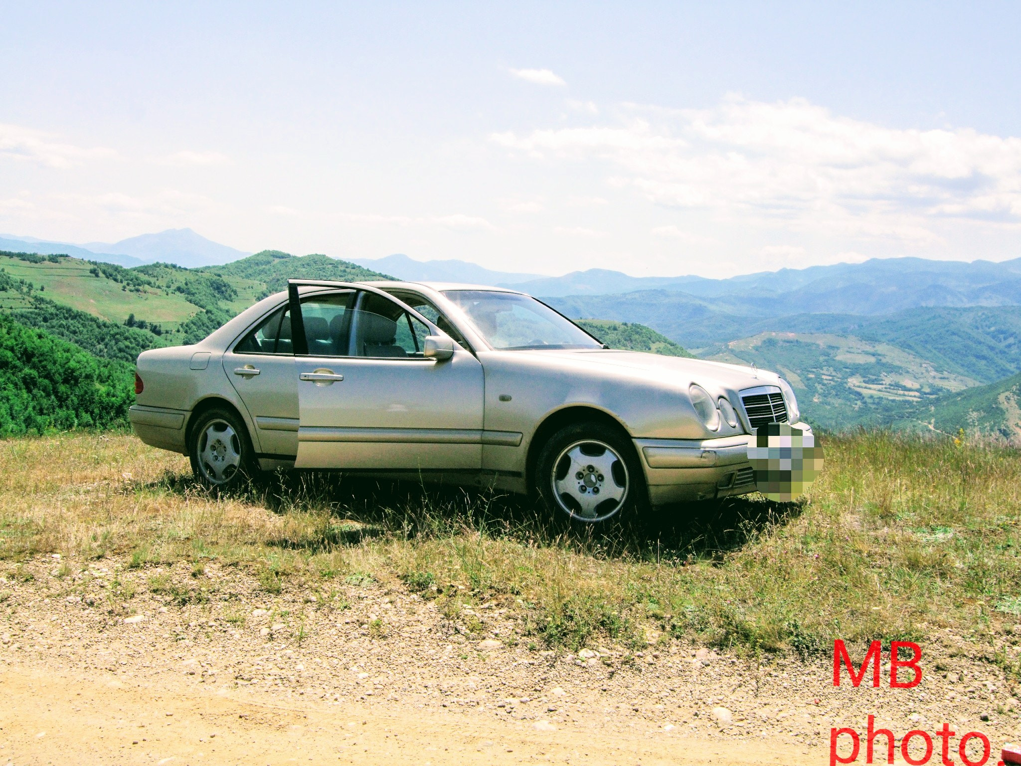 Fujifilm FinePix F50fd sample photo. At the top of the mountain by car photography