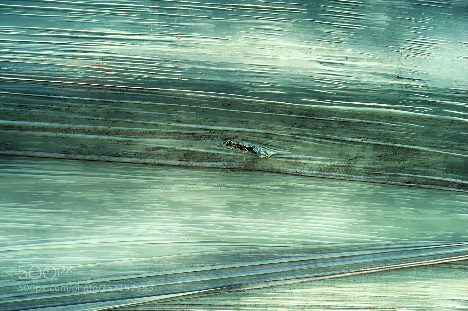Sony a7 sample photo. Damaged green hay ball photography