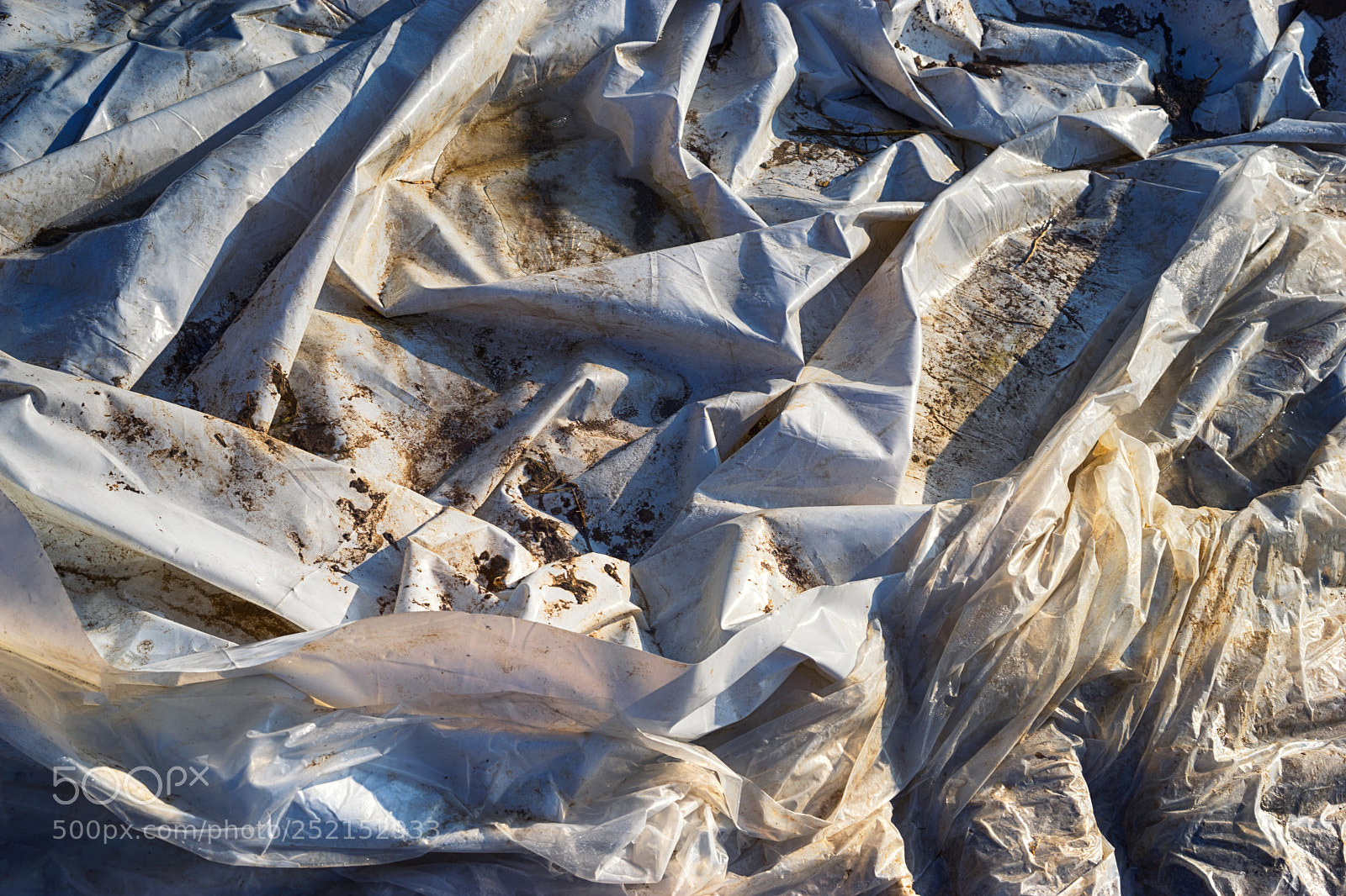 Sony a7 sample photo. White and dirty tarpaulin photography