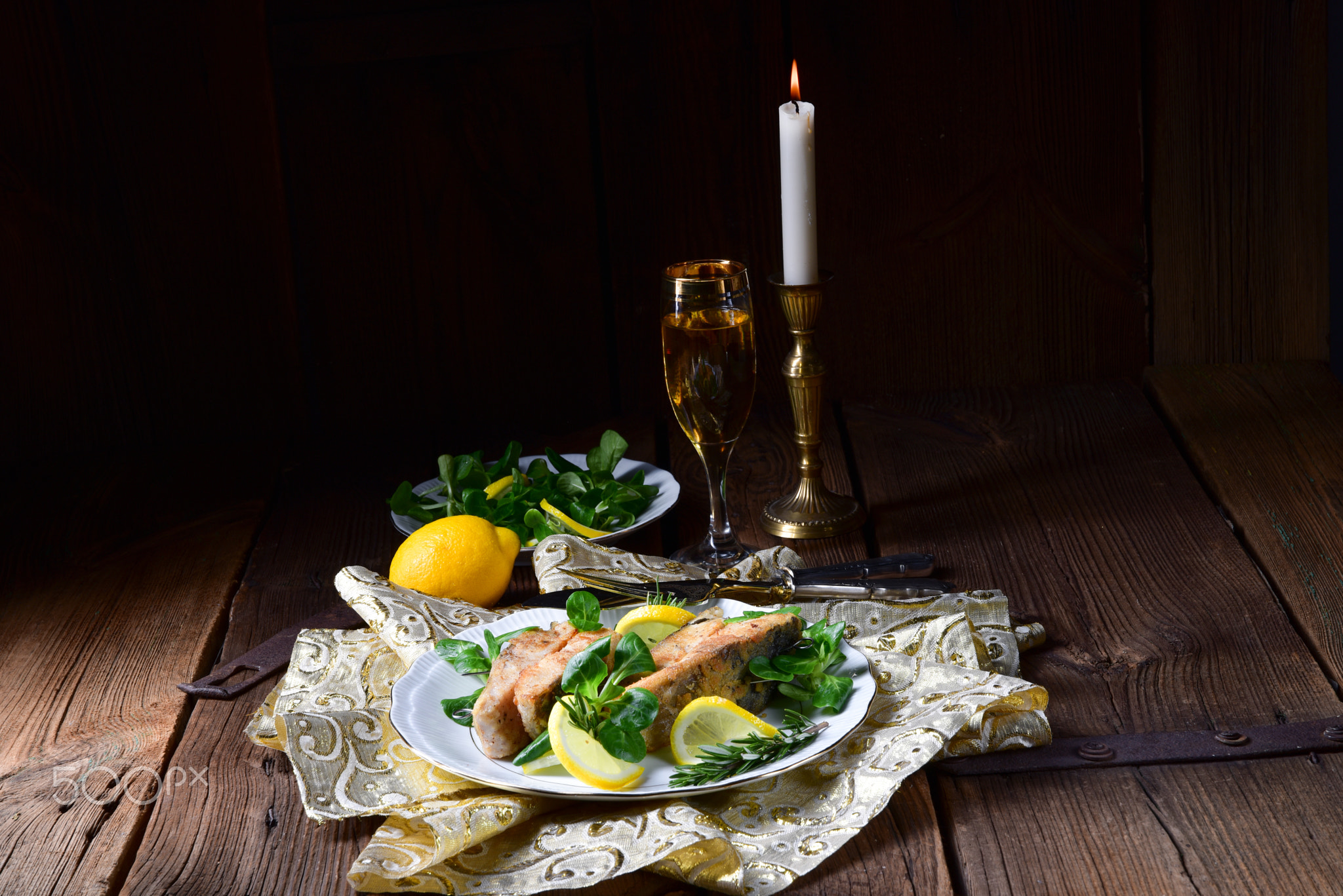 Fried carp fillet on wintry salad