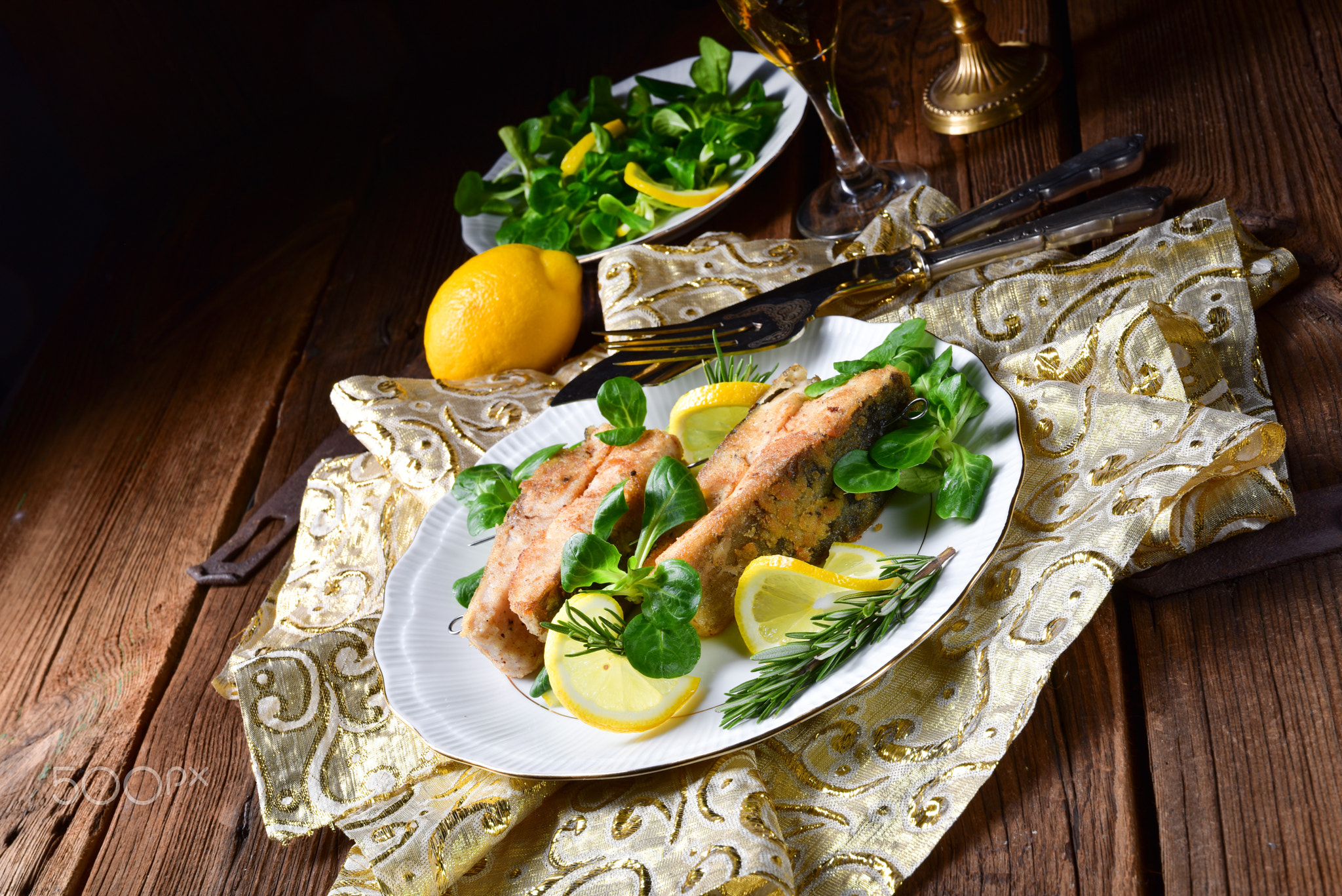 Fried carp fillet on wintry salad