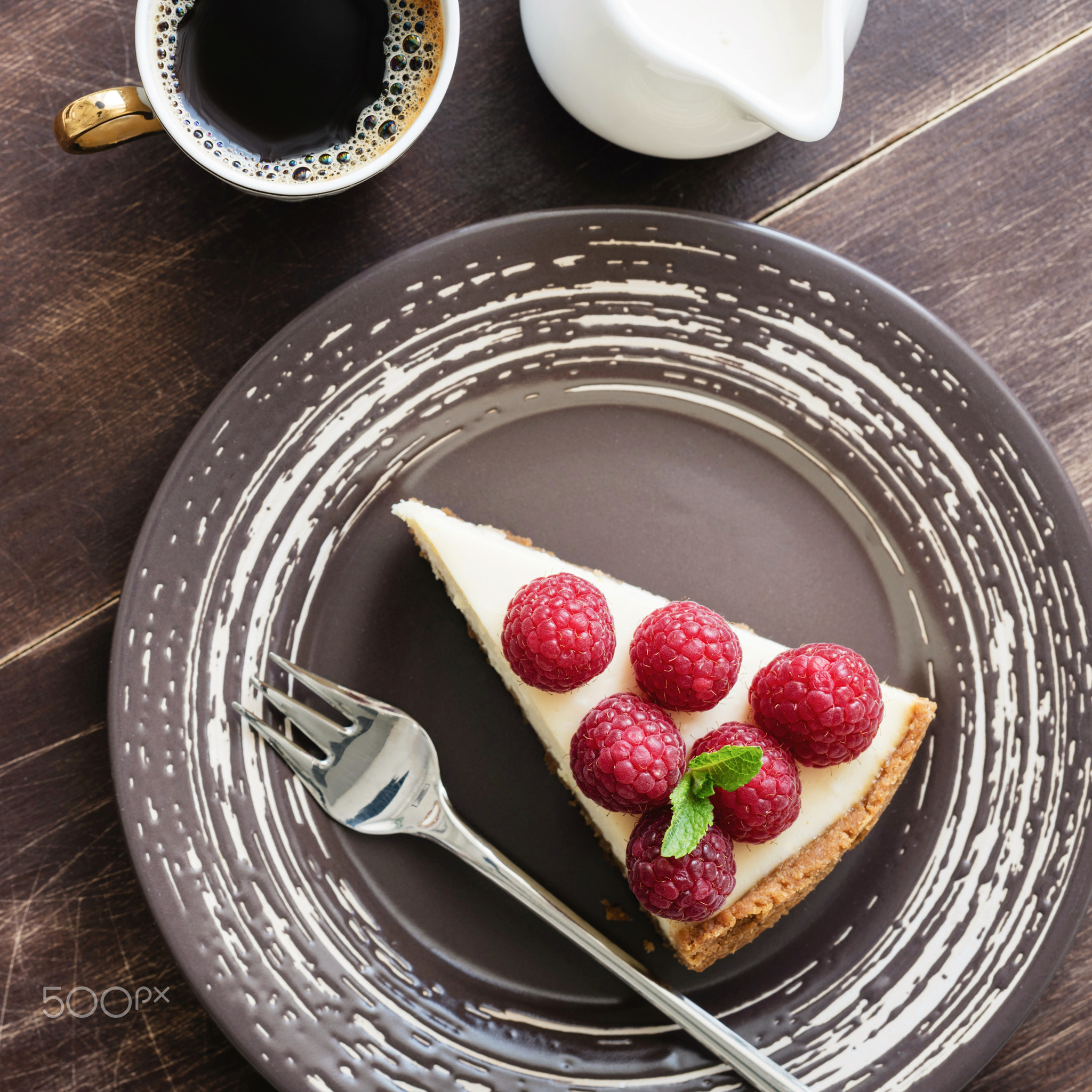 Cheesecake with raspberries, coffee and cream. Top view