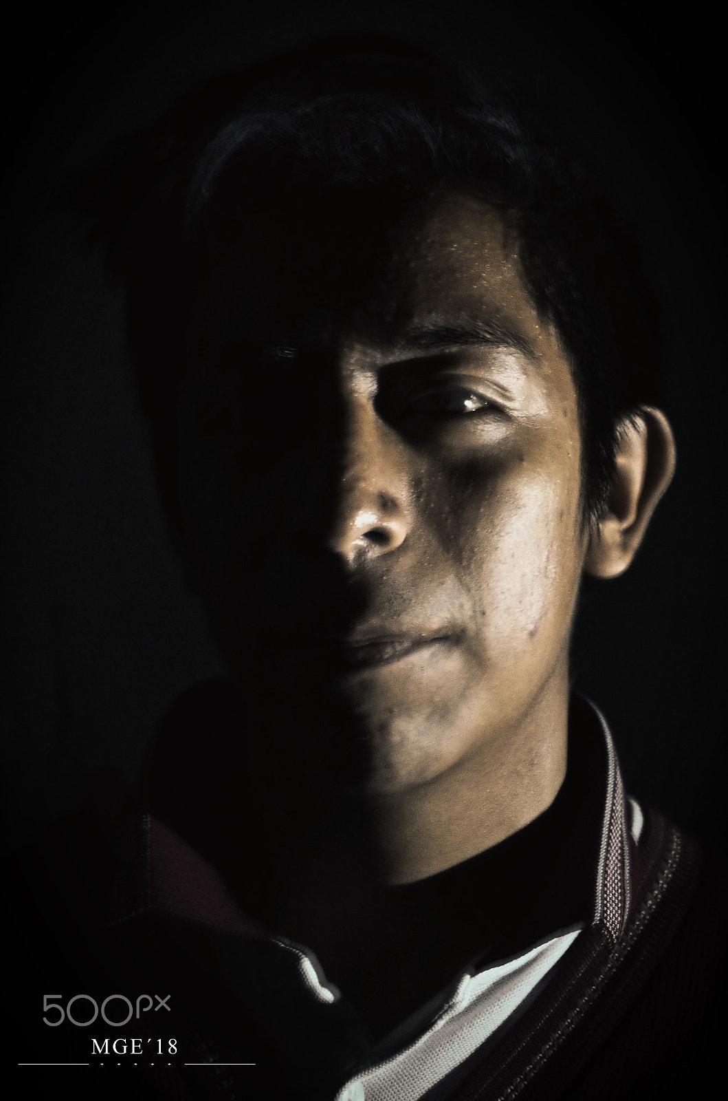 Pentax K-50 sample photo. The portrait of a student in the dark. photography