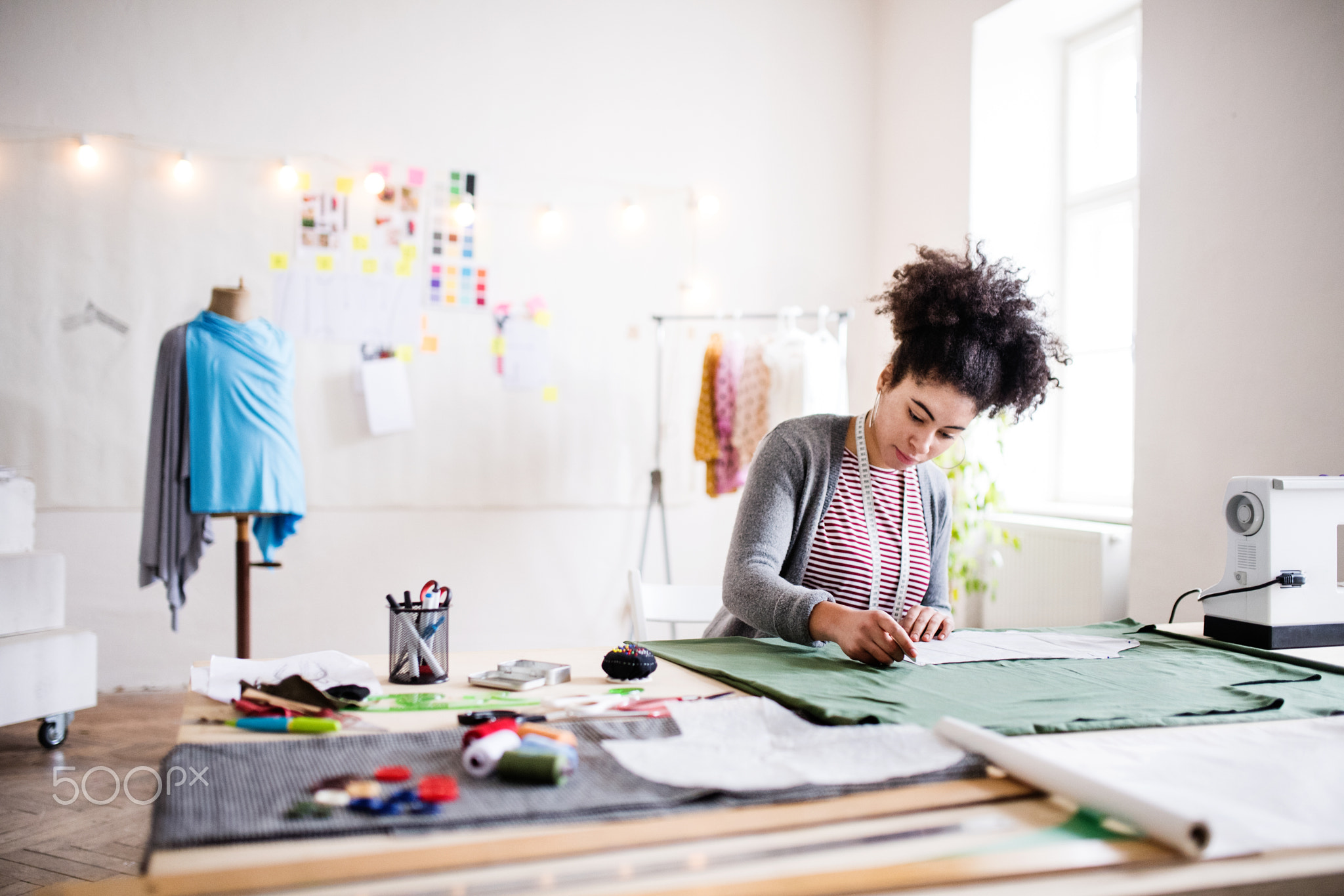 Young creative woman in a studio, startup business.