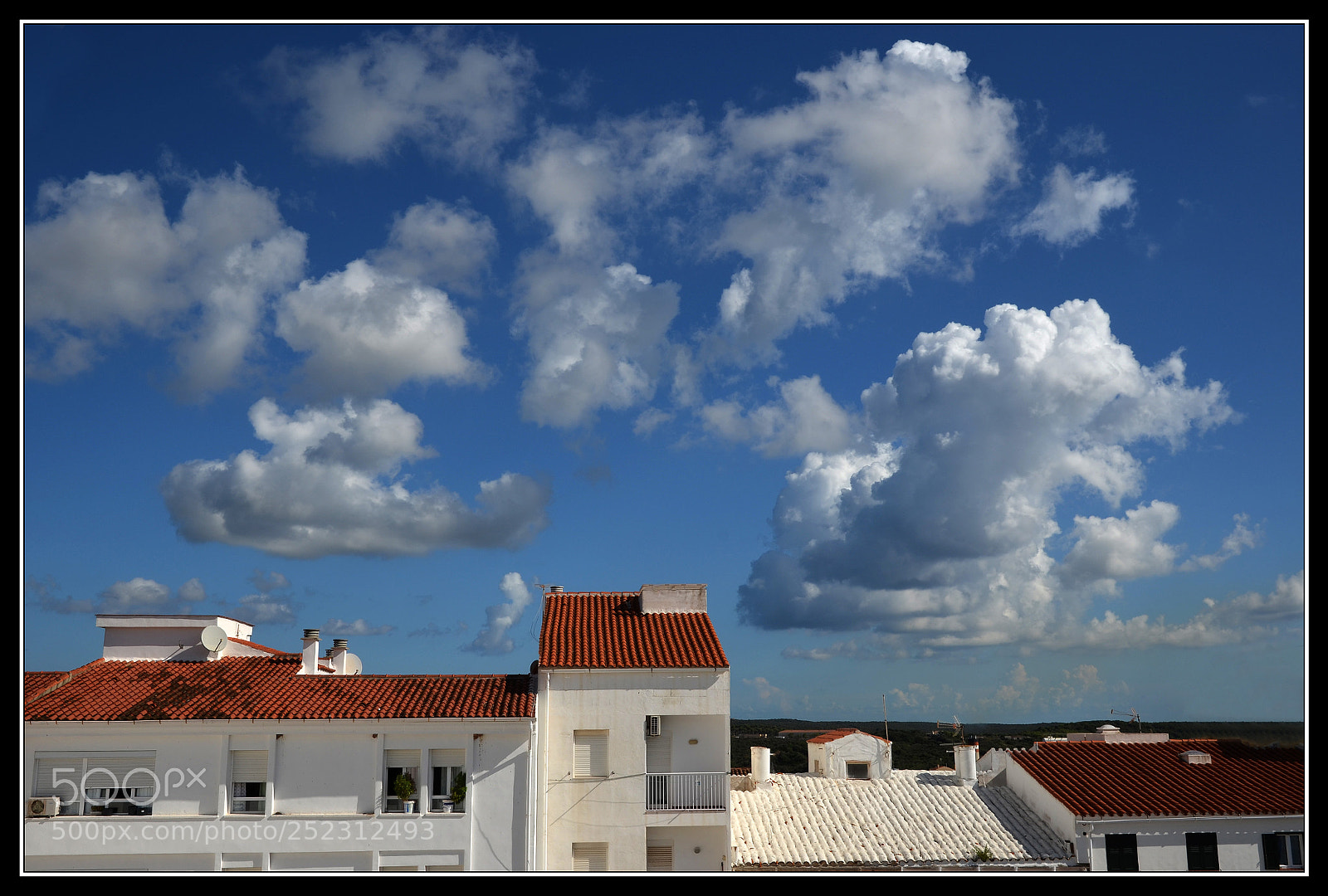 Nikon D5100 sample photo. Clouds over the roofs photography