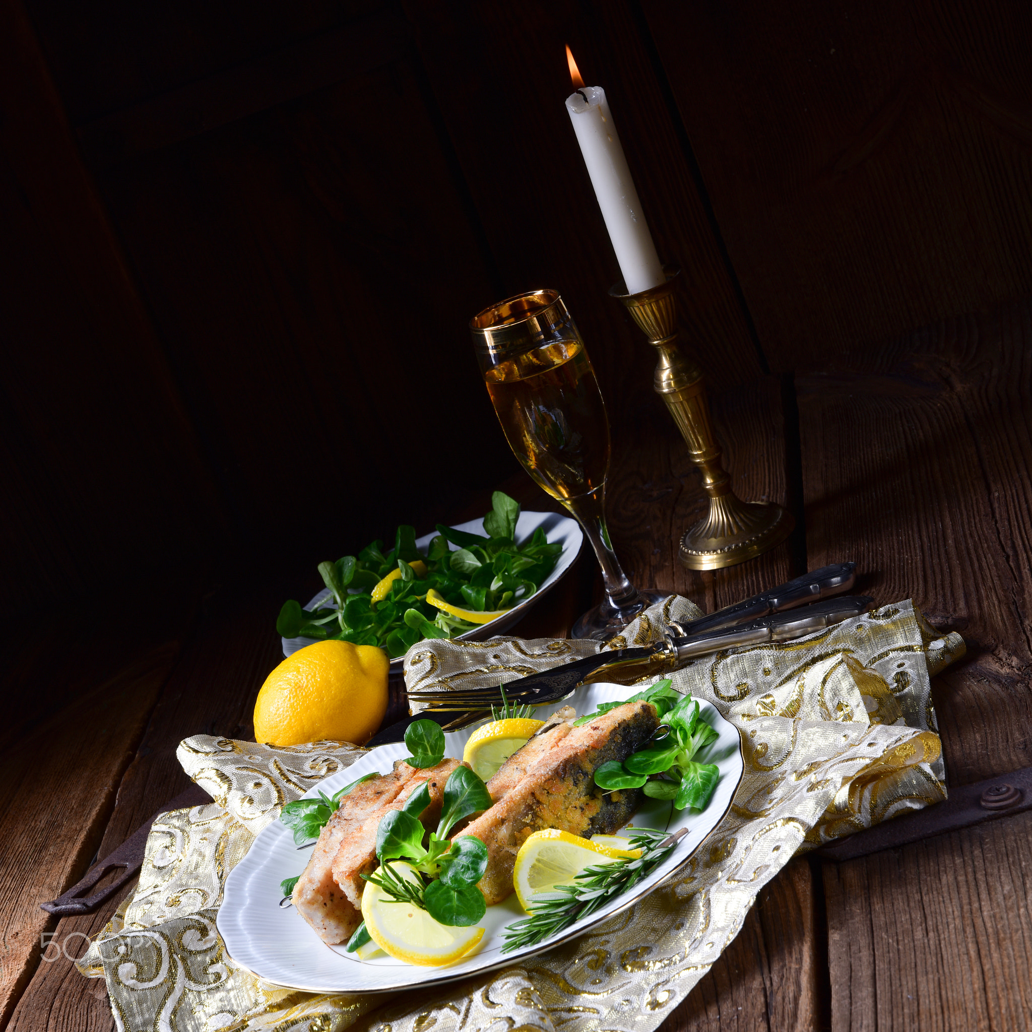 Fried carp fillet on wintry salad