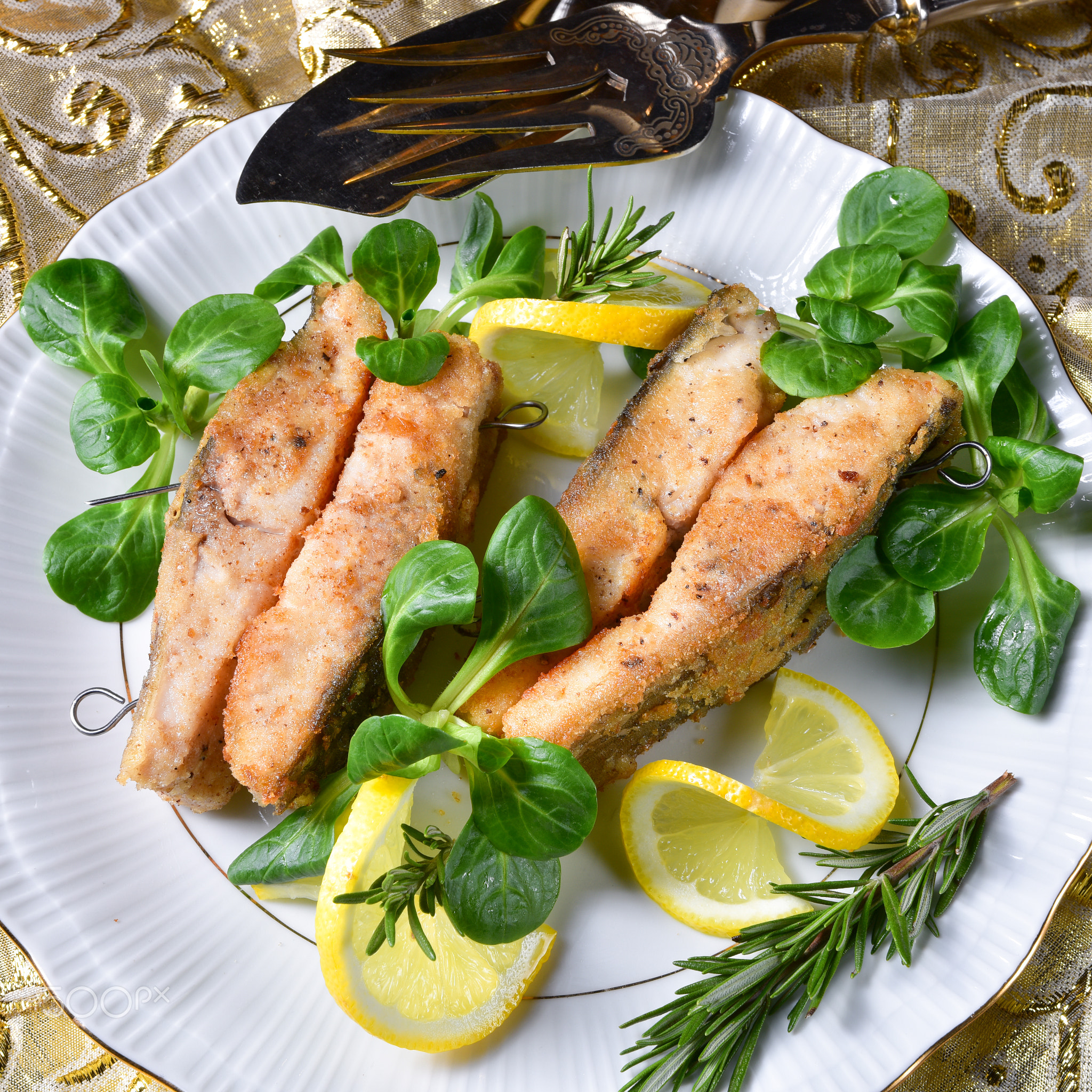 Fried carp fillet on wintry salad