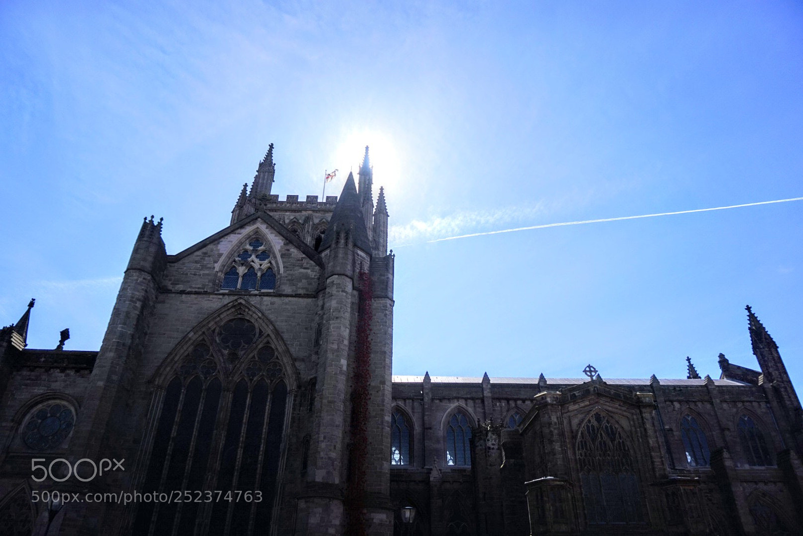 Sony Alpha a5000 (ILCE 5000) sample photo. Sun over cathedral tower photography