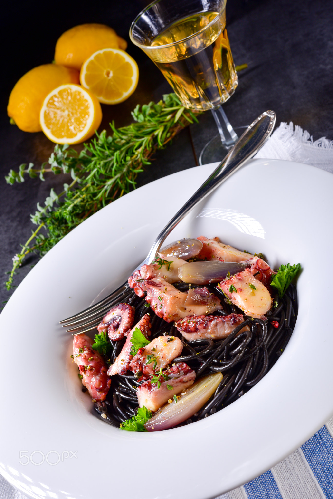 octopus with black spaghetti and garlic sauce
