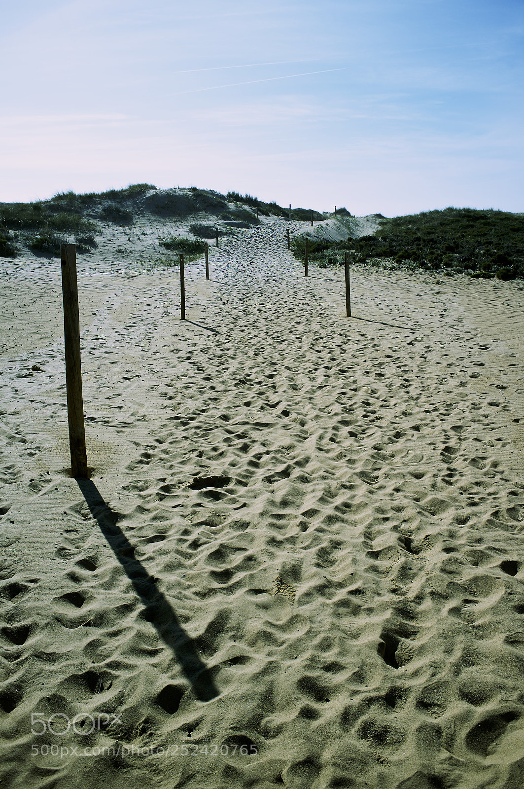 Fujifilm FinePix X100 sample photo. Sand, posts photography
