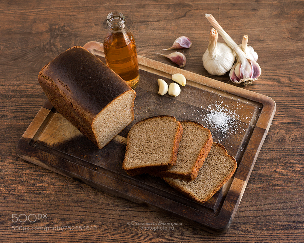 Sony a7 sample photo. Rye bread, salt, garlic photography