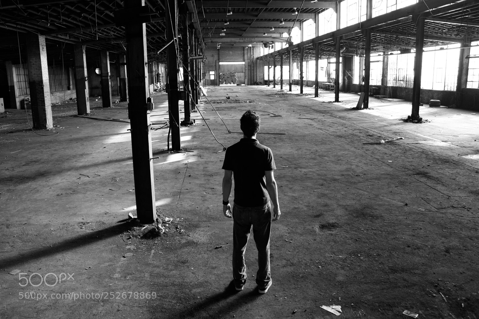 Canon EOS 1000D (EOS Digital Rebel XS / EOS Kiss F) sample photo. Man in old factory photography