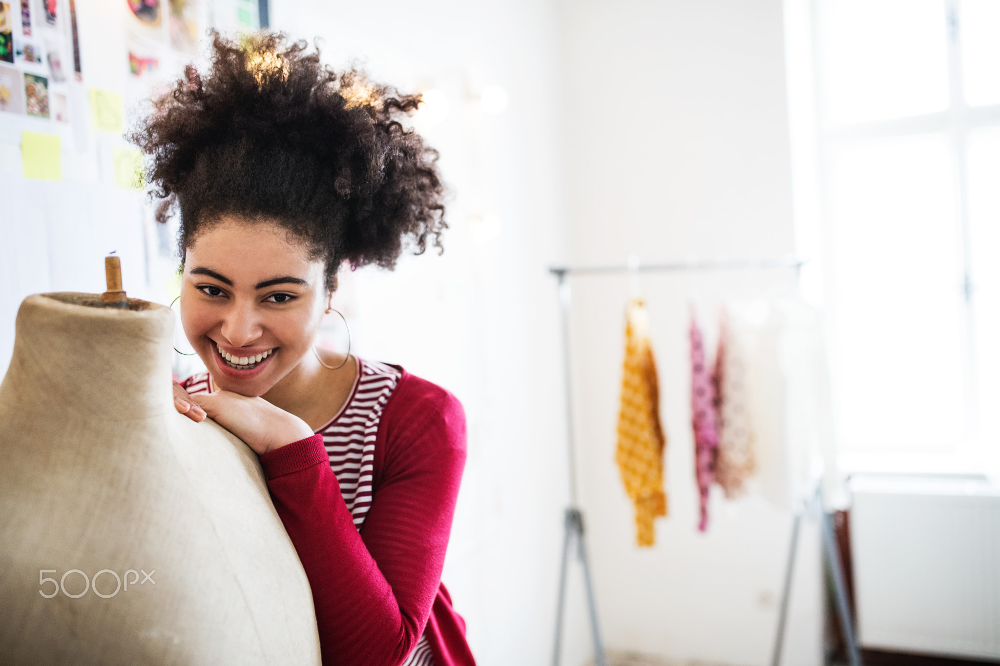 Young creative woman in a studio, startup business.