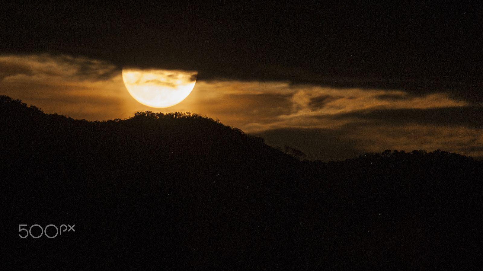 Sony Alpha DSLR-A380 sample photo. Moon hiding among the clouds and the mount. photography