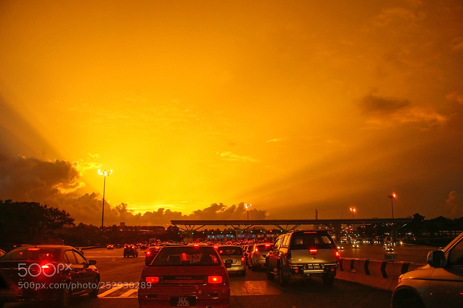 Canon EOS 400D (EOS Digital Rebel XTi / EOS Kiss Digital X) sample photo. Sunset at toll plaza photography