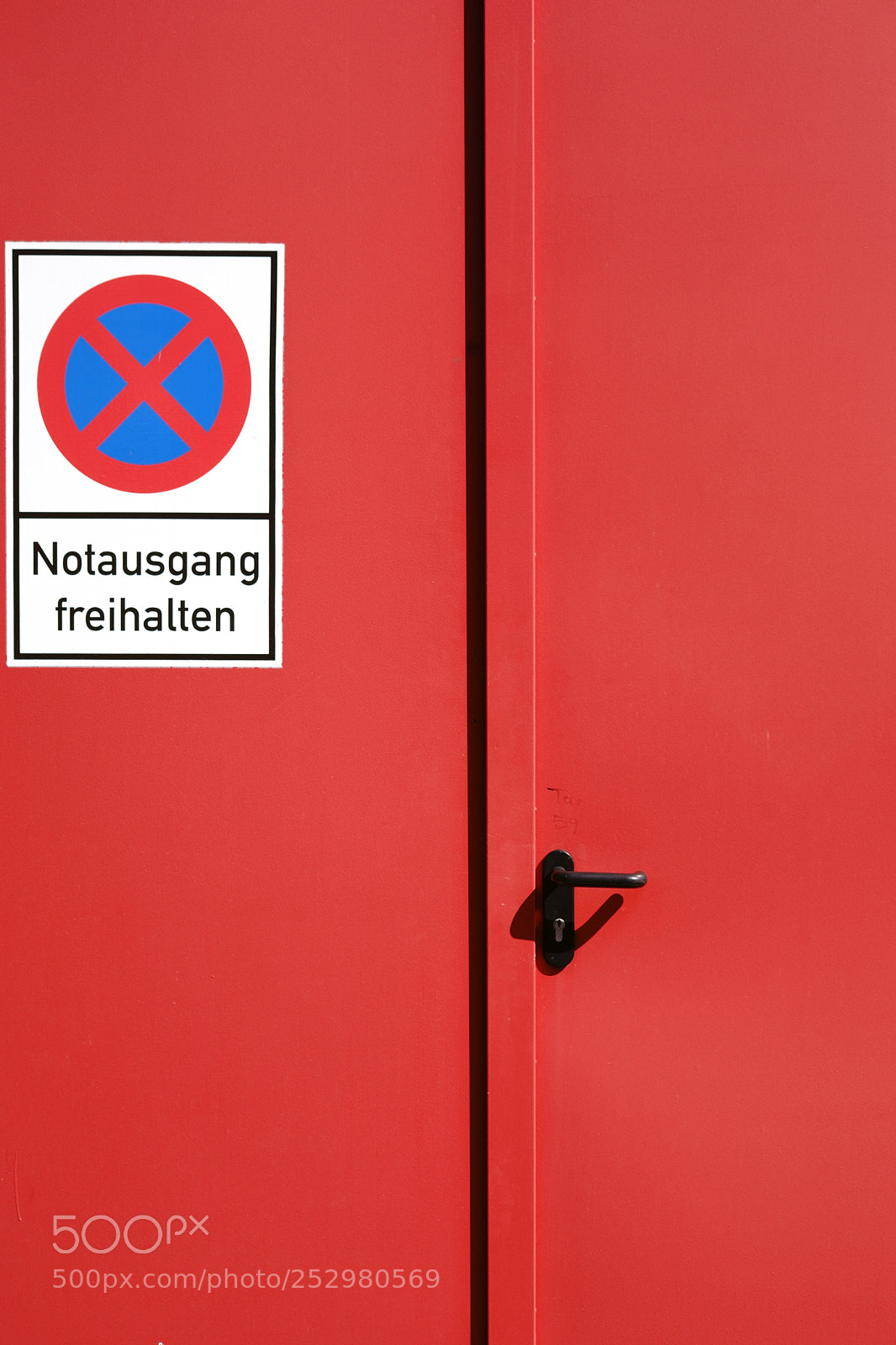 Sony a7 II sample photo. Red painted emergency exit photography