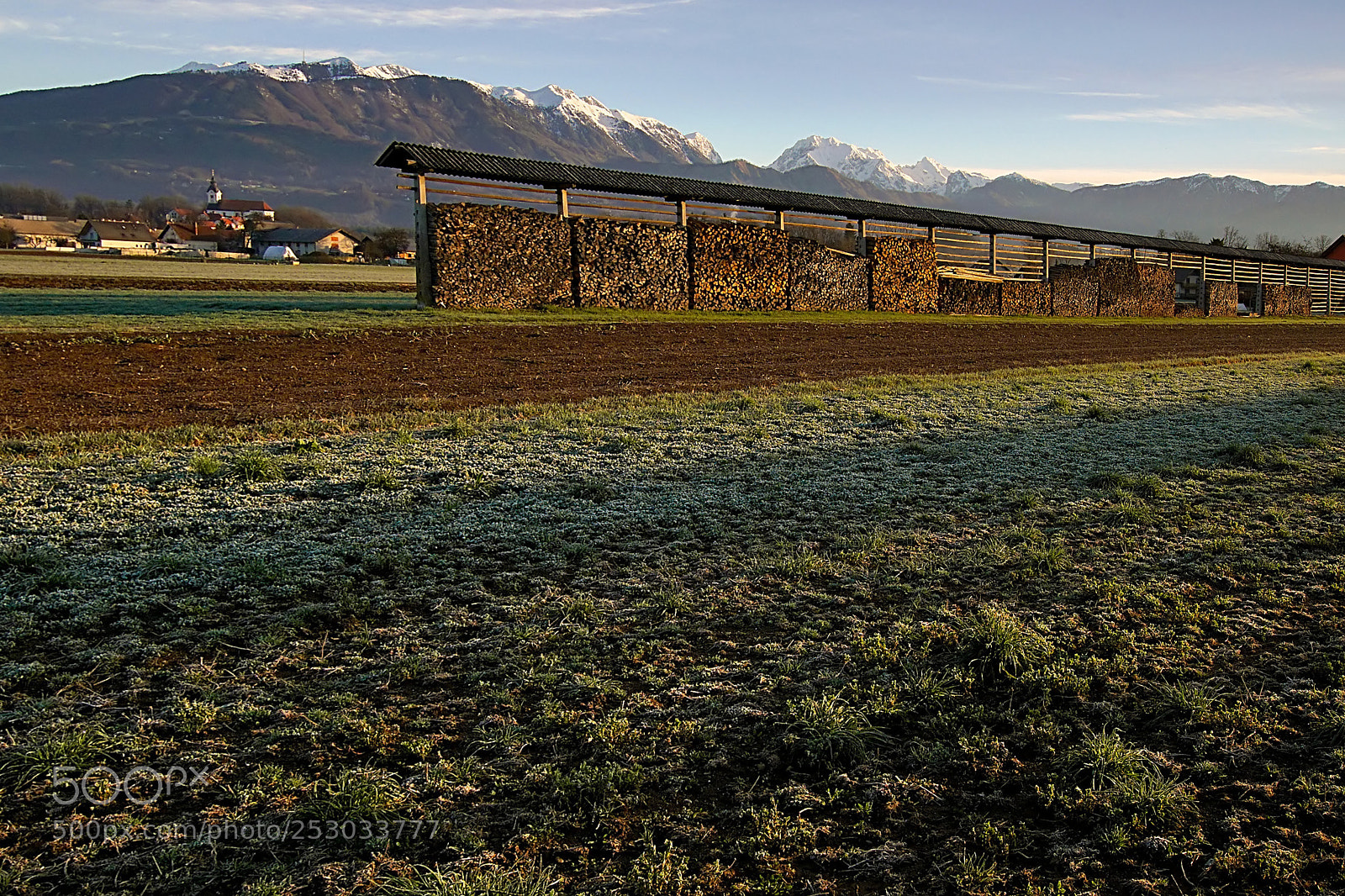 Sony ILCA-77M2 sample photo. Hayrack of firewood photography