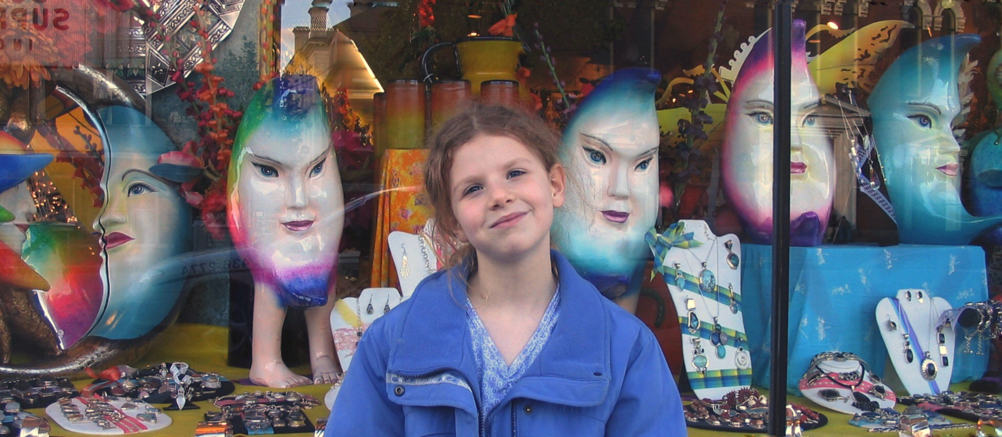 Canon POWERSHOT A70 sample photo. Blue-eyed faces in a shop window photography
