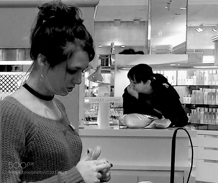 Apple iPhone 6 Plus sample photo. Sales woman ignores bored photography