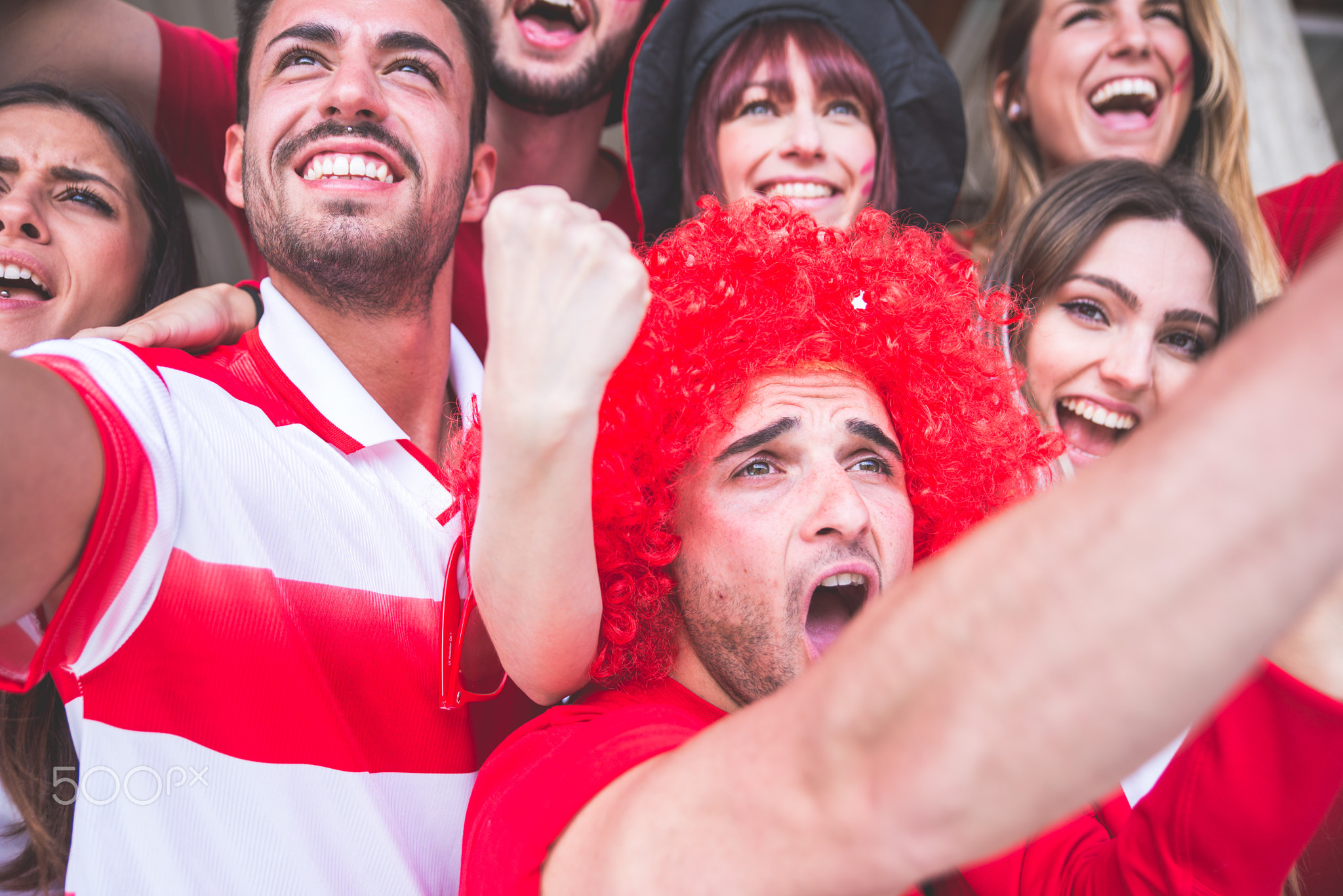 Football fans supporting their team at the arena for the world c