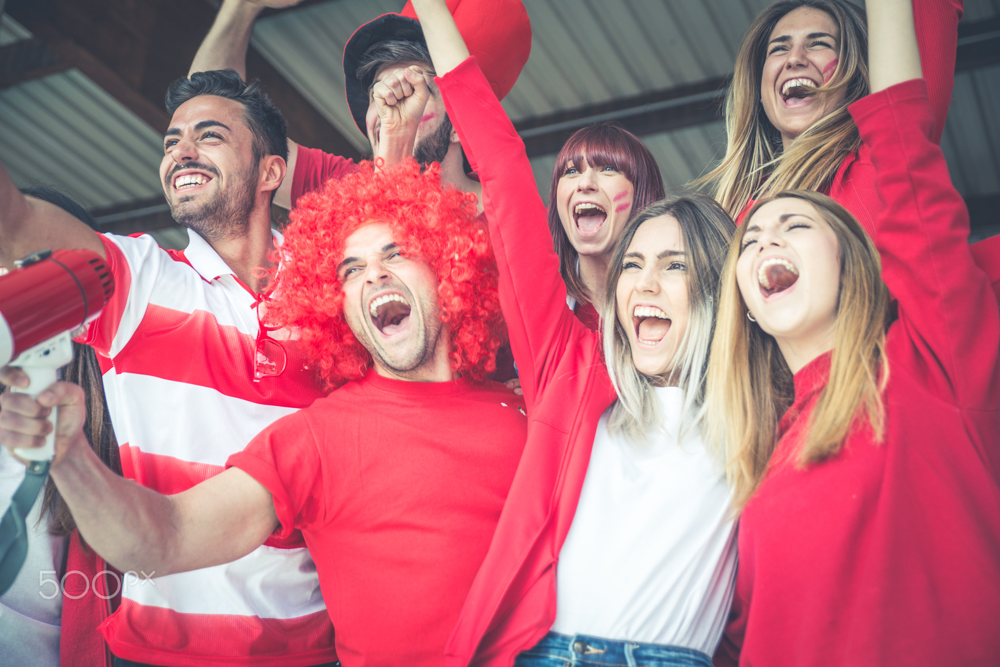 Football fans supporting their team at the arena for the world c