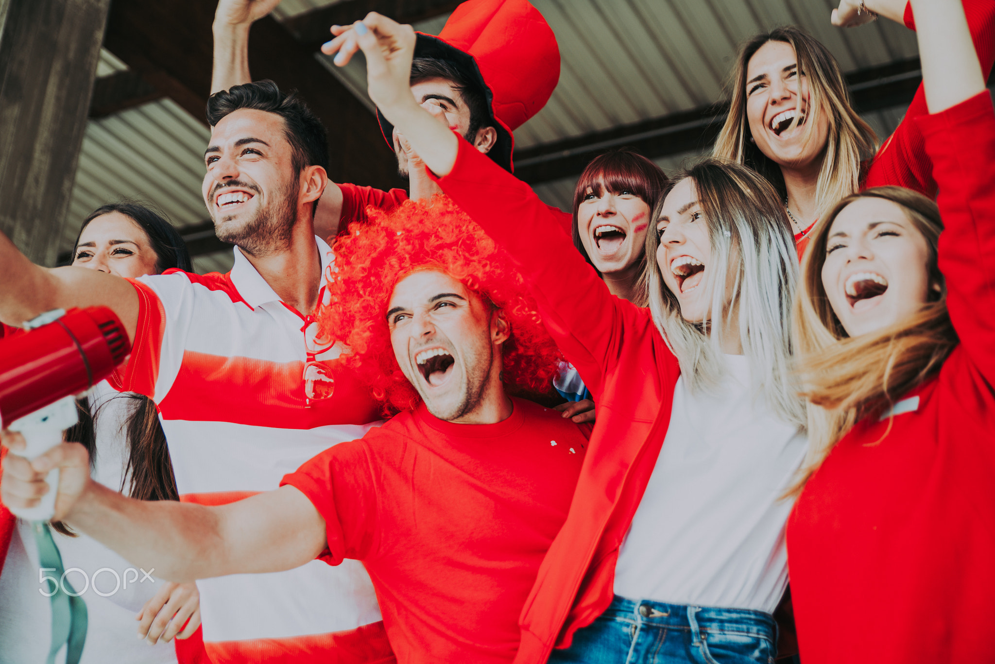 Football fans supporting their team at the arena for the world c