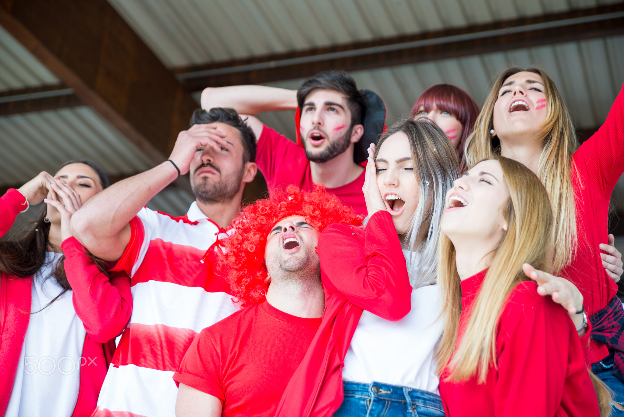 Football fans supporting their team at the arena for the world c