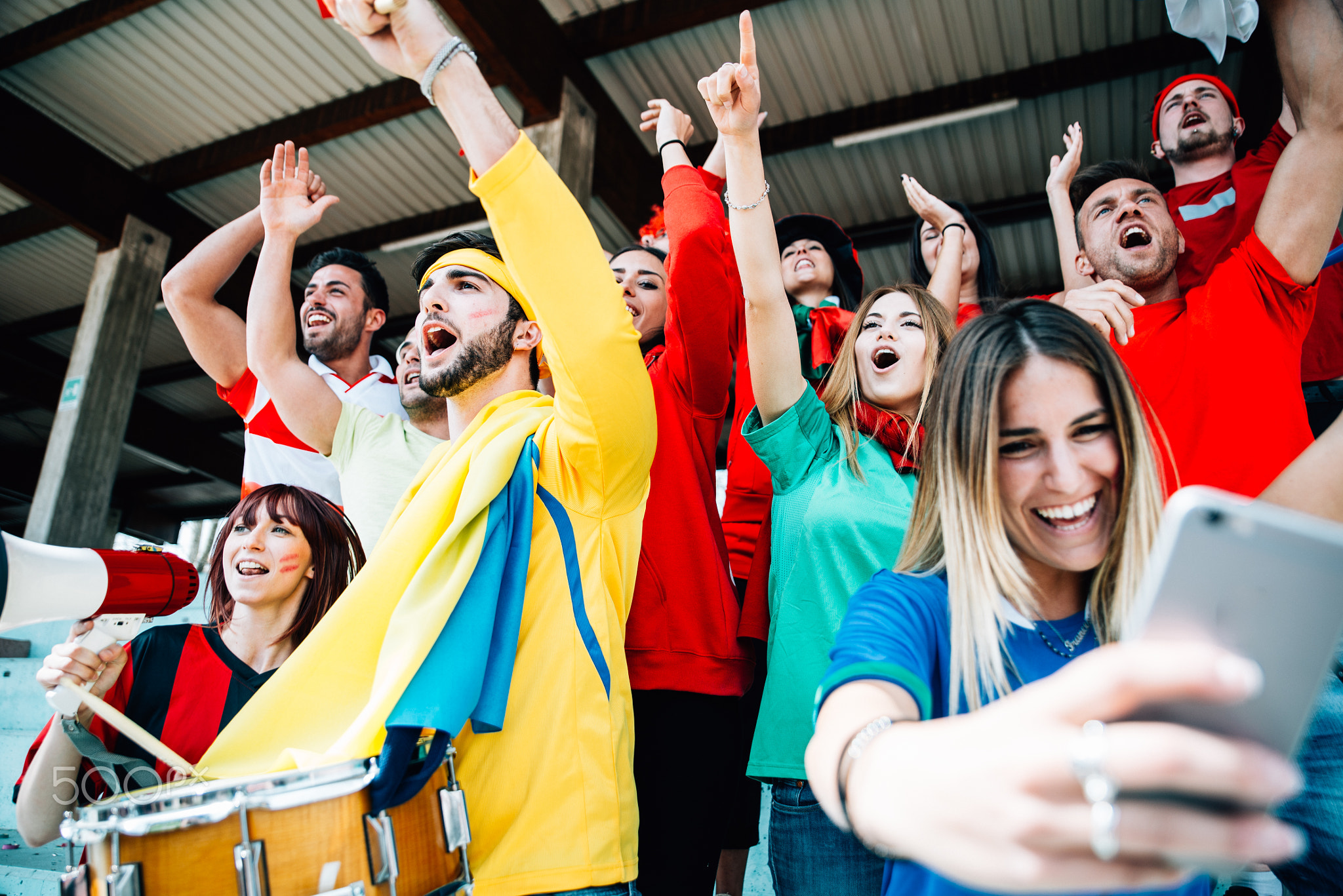 Football fans supporting their team at the arena for the world c