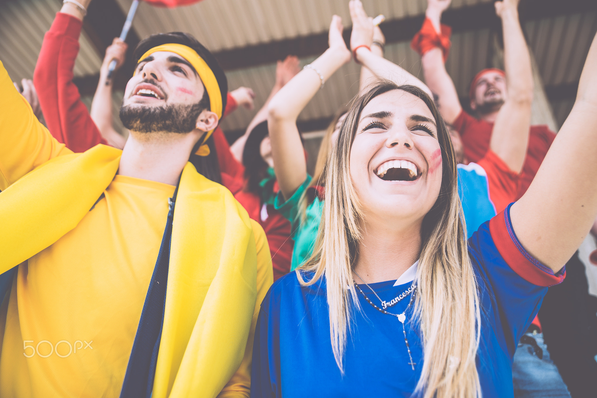 Football fans supporting their team at the arena for the world c