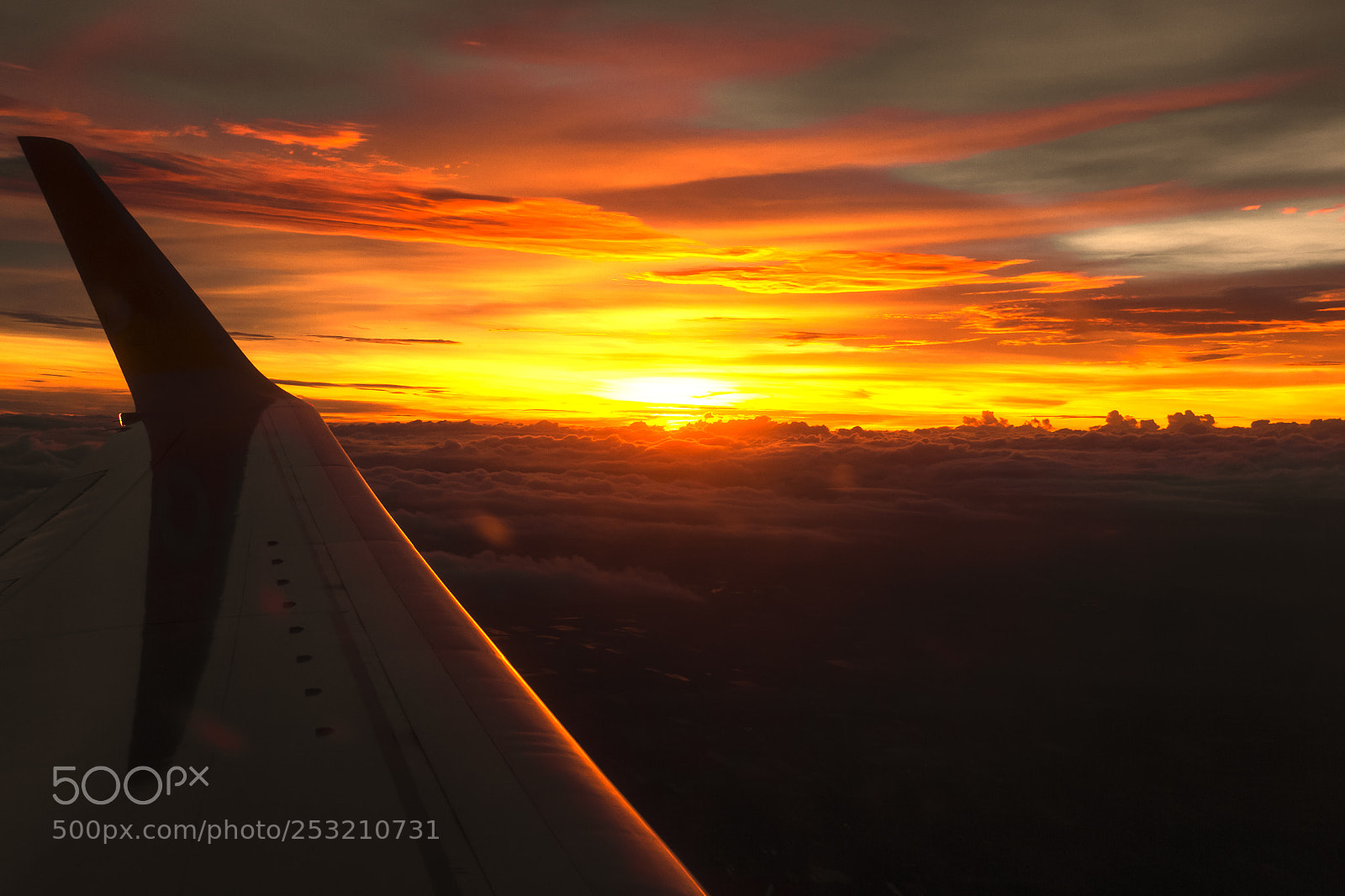 Canon EOS 7D sample photo. Wing of airplane over photography