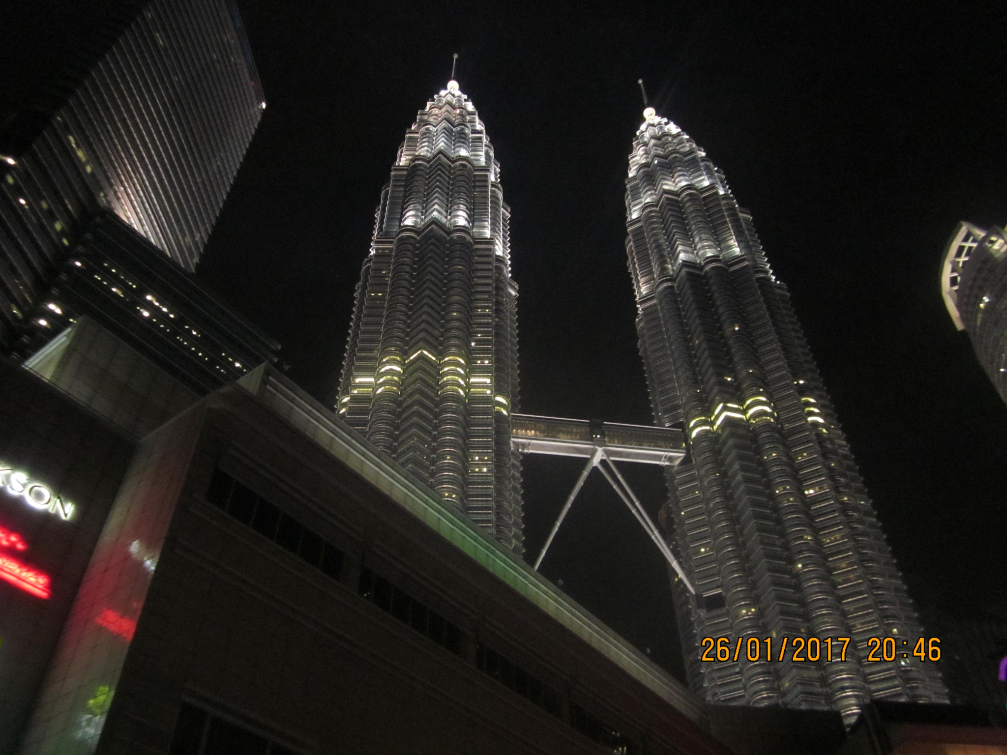 Canon PowerShot SD1300 IS (IXUS 105 / IXY 200F) sample photo. The twin towers at night photography