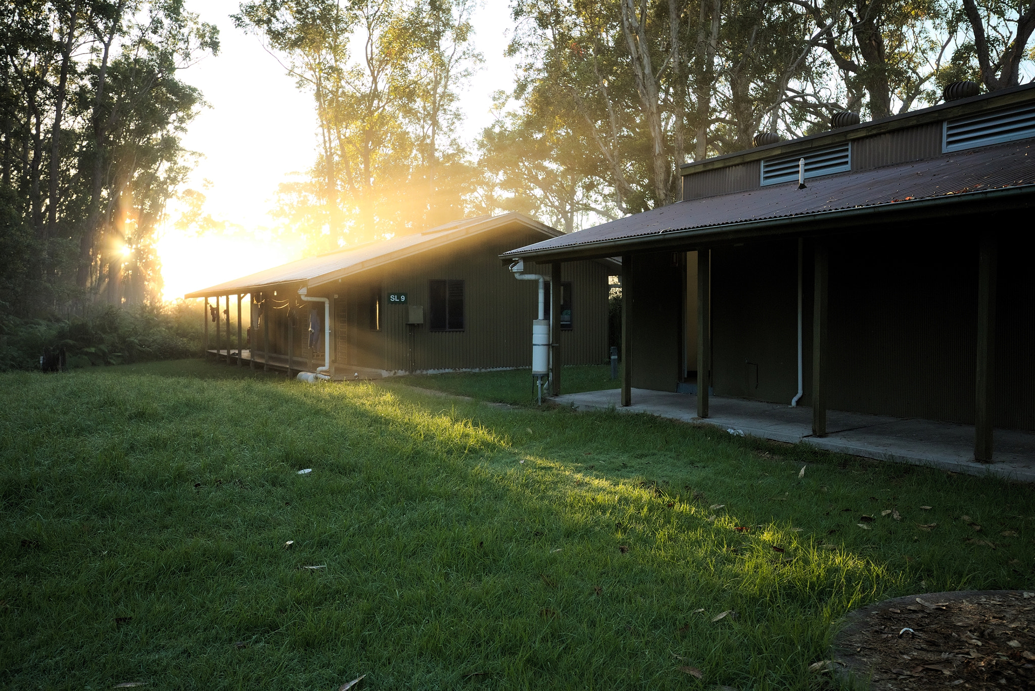 Canon EF 16-35mm F4L IS USM sample photo. Morning light spills over cabin photography