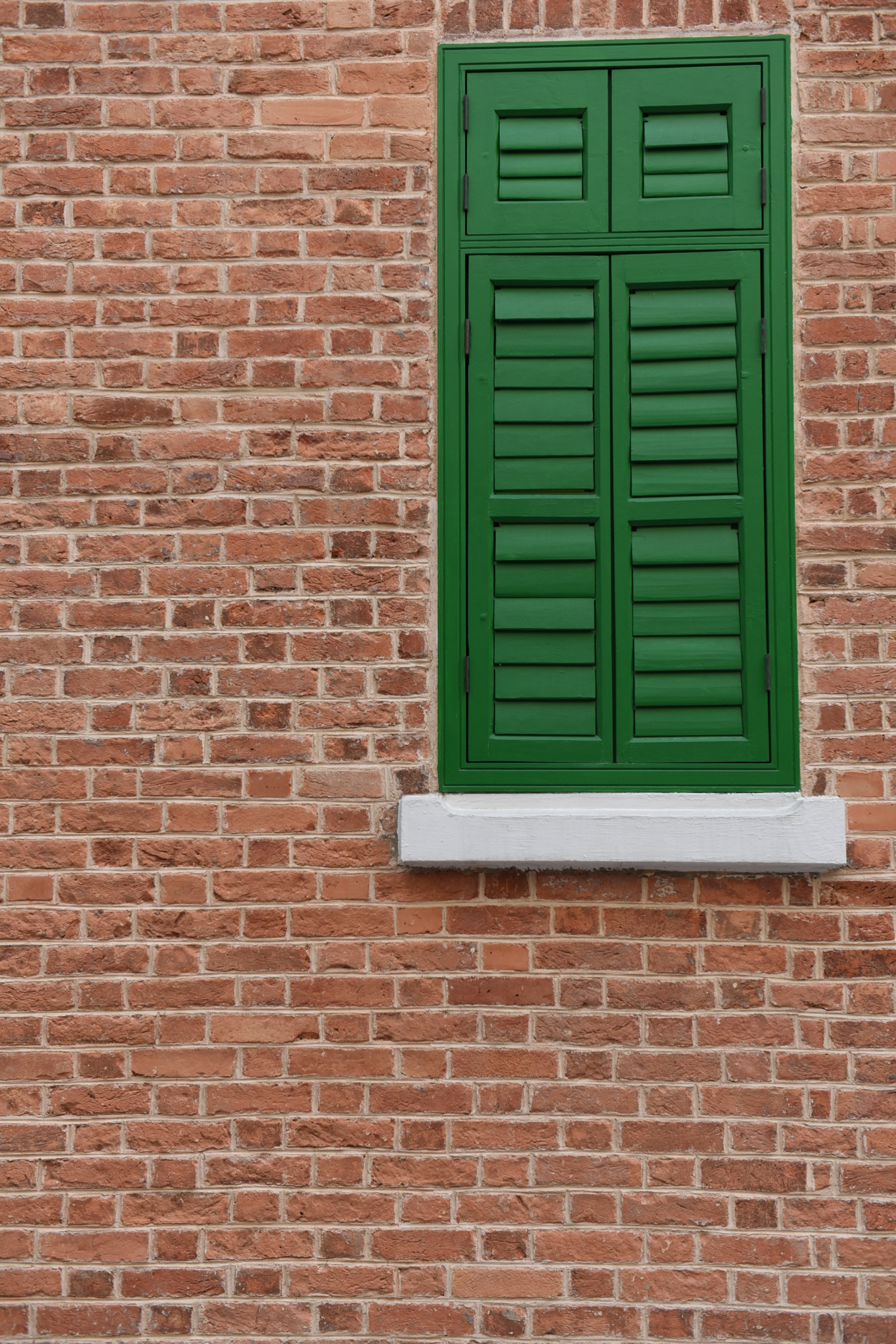 Nikon AF-S Nikkor 24-70mm F2.8G ED sample photo. Red brick and green window photography