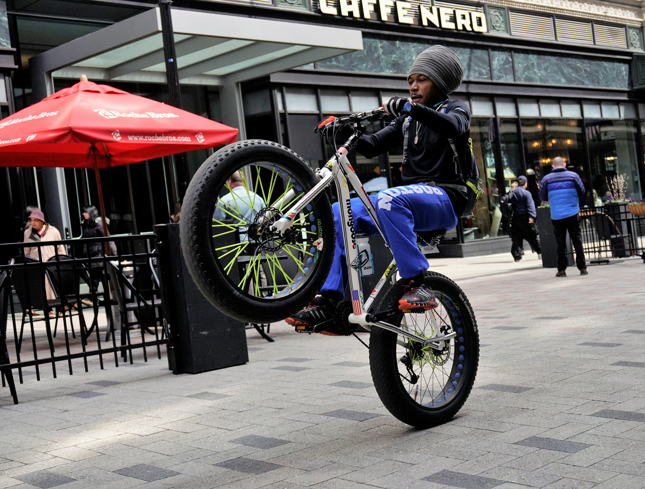 Sony E 16-50mm F3.5-5.6 PZ OSS sample photo. Bike rider having fun on summer st boston ma photography