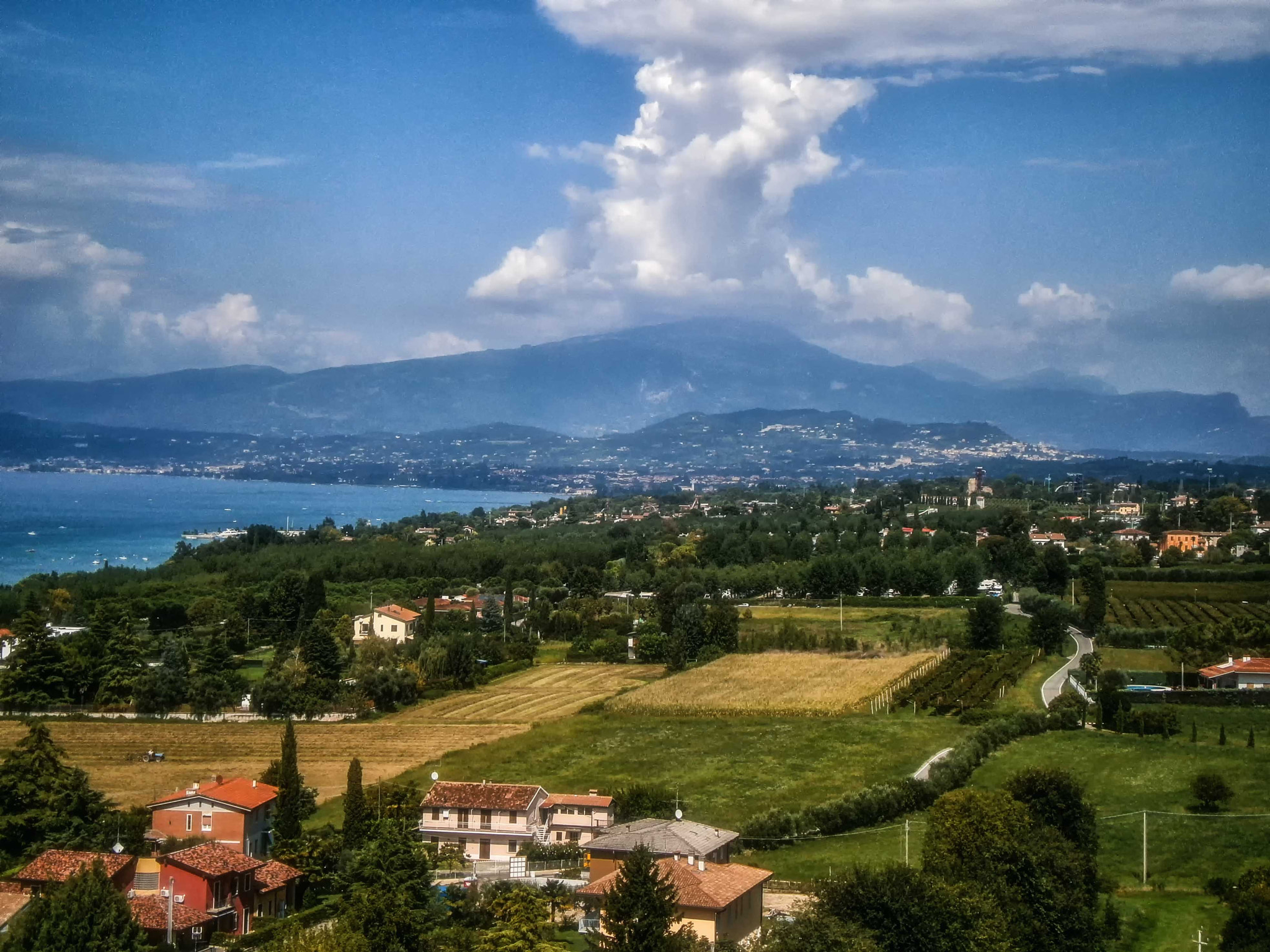 Olympus VG160,X990,D745 sample photo. Lake garda and the alps photography